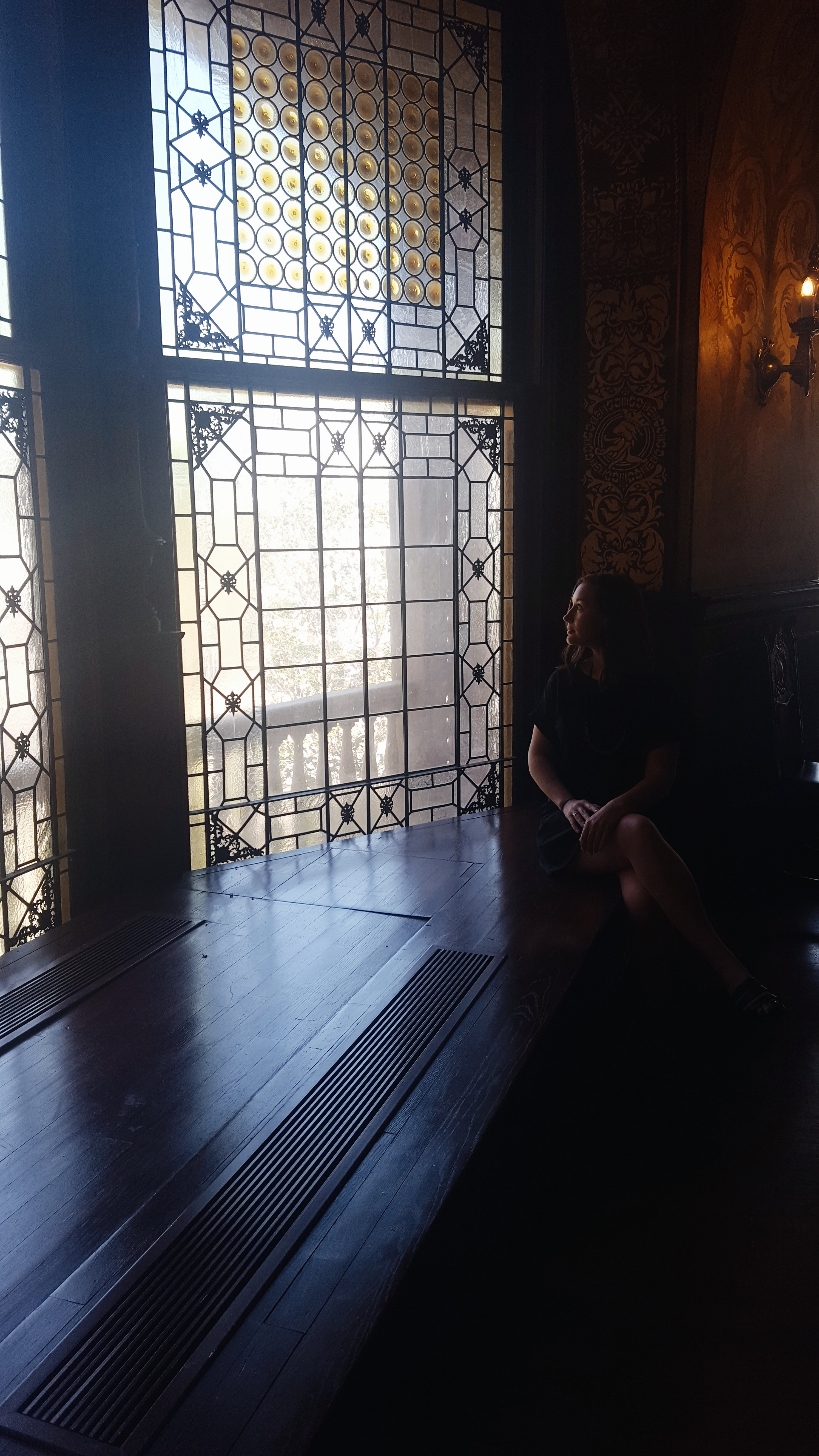 Alyssa looks out the Tiffany glass windows at Flagler College in St. Augustine