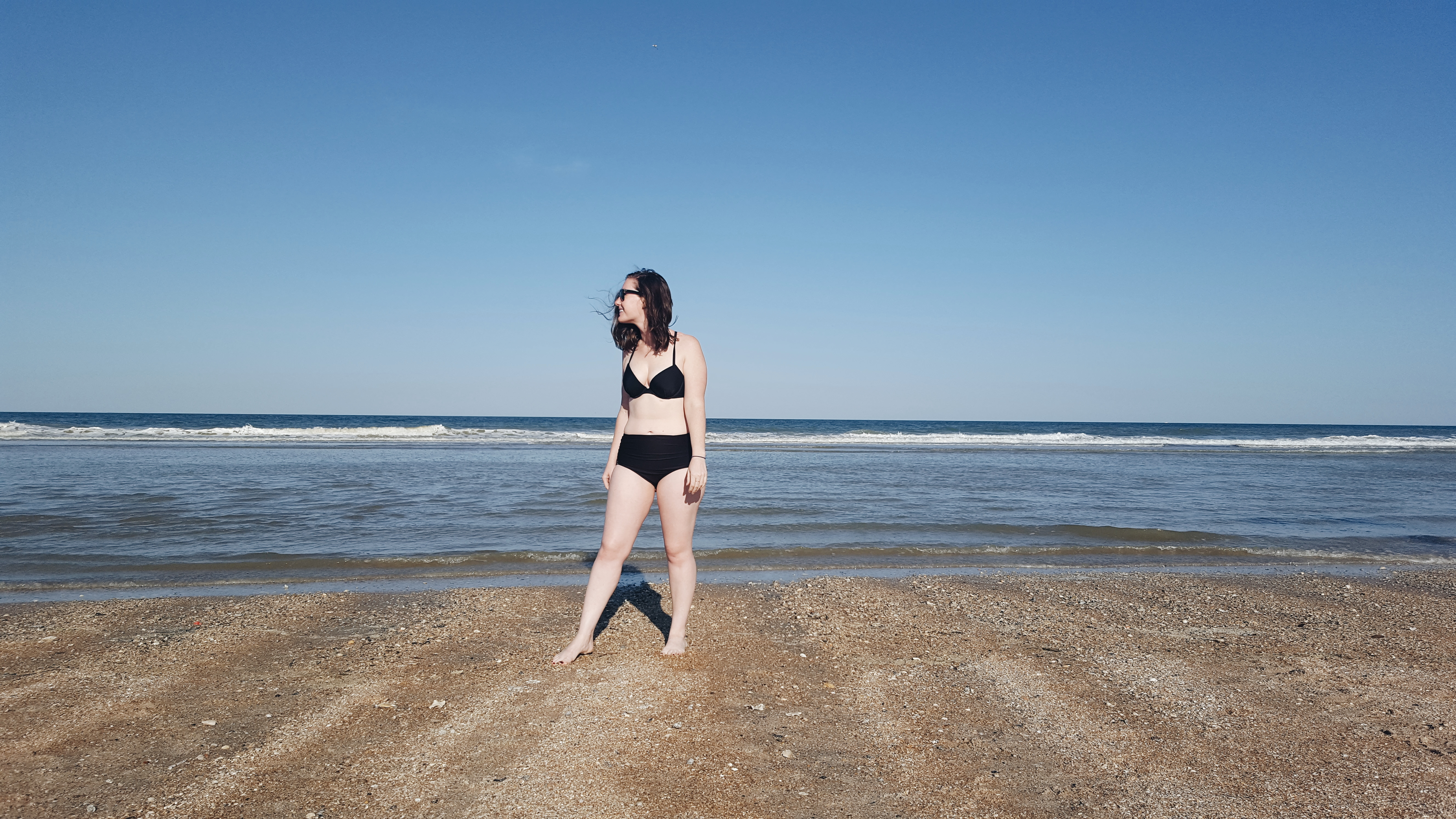 Alyssa stands on St. Augustine Beach