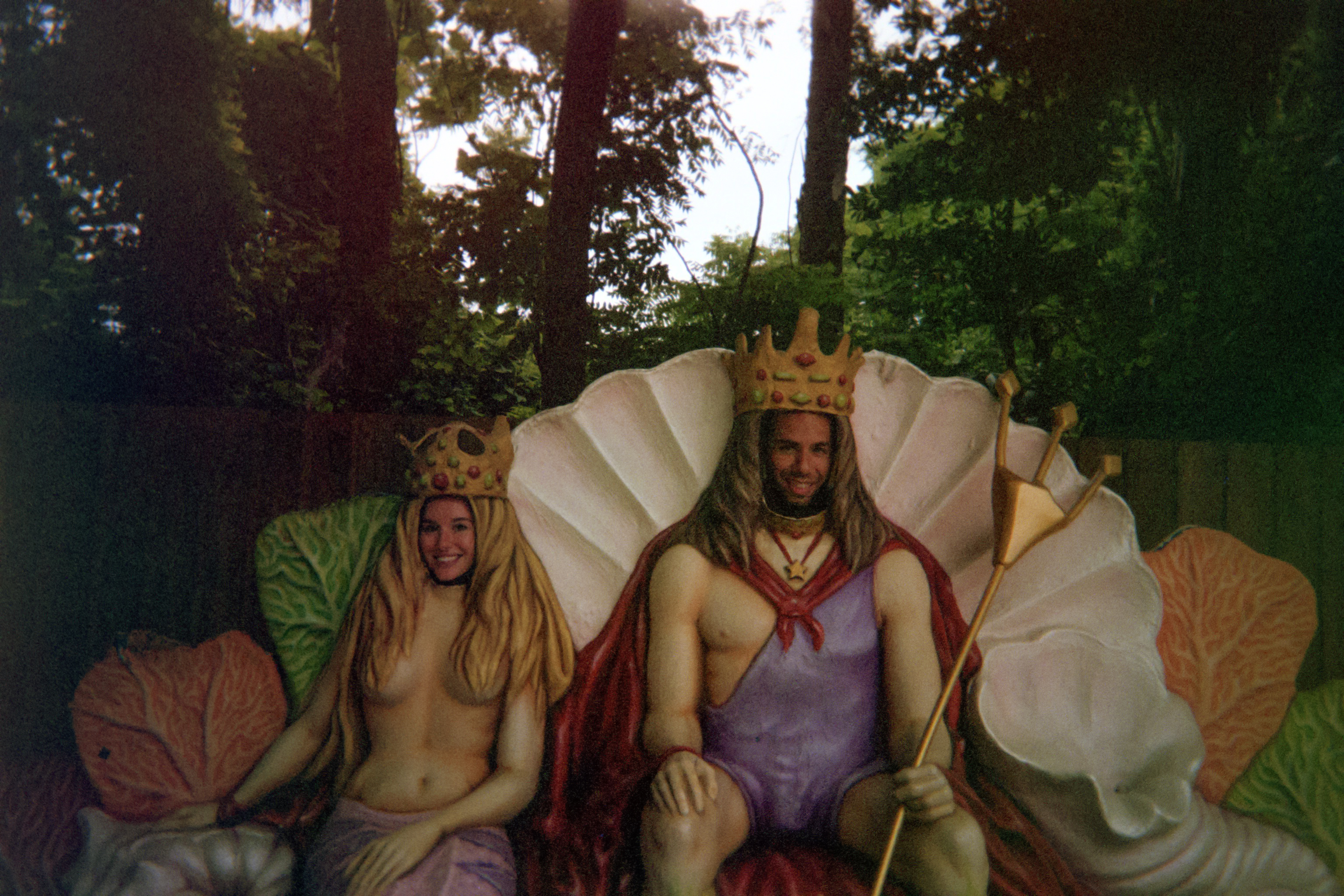 Alyssa and Michael at a cheesy photo point at the theme park