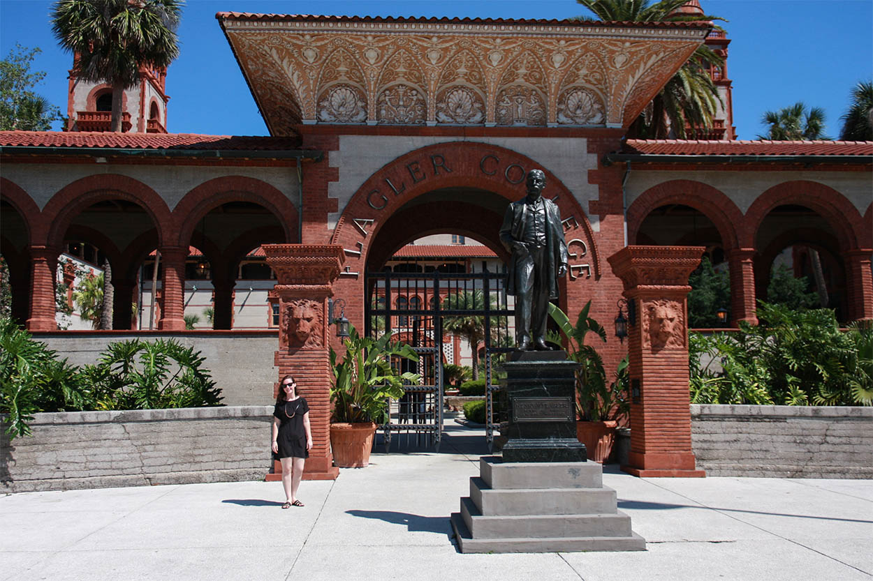 Alyssa stands in front of the entrance to Flagler College