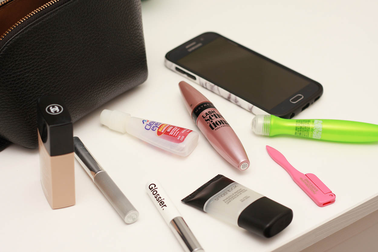 A white countertop with makeup products