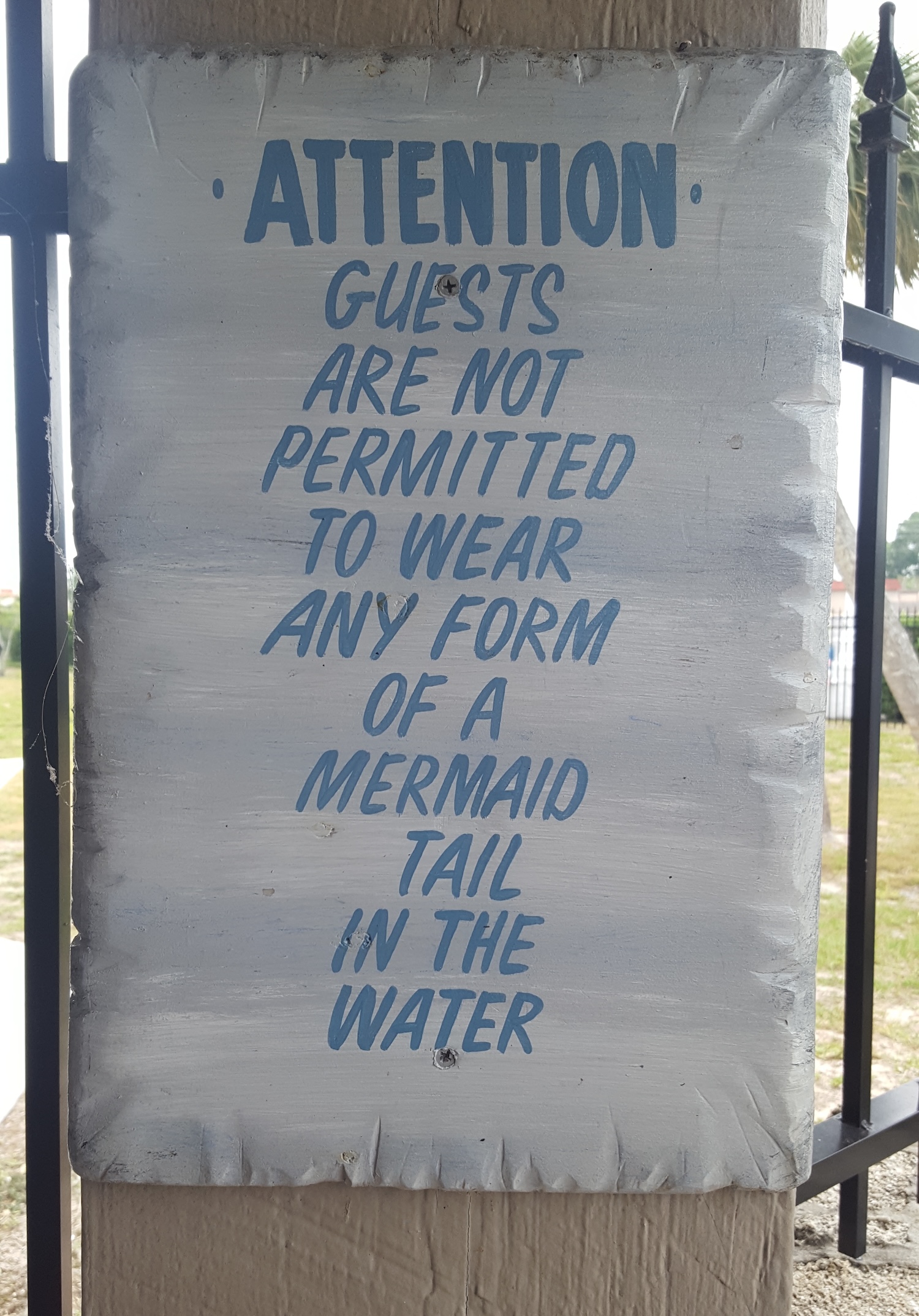 A sign warning guests they may not wear a tail in the water