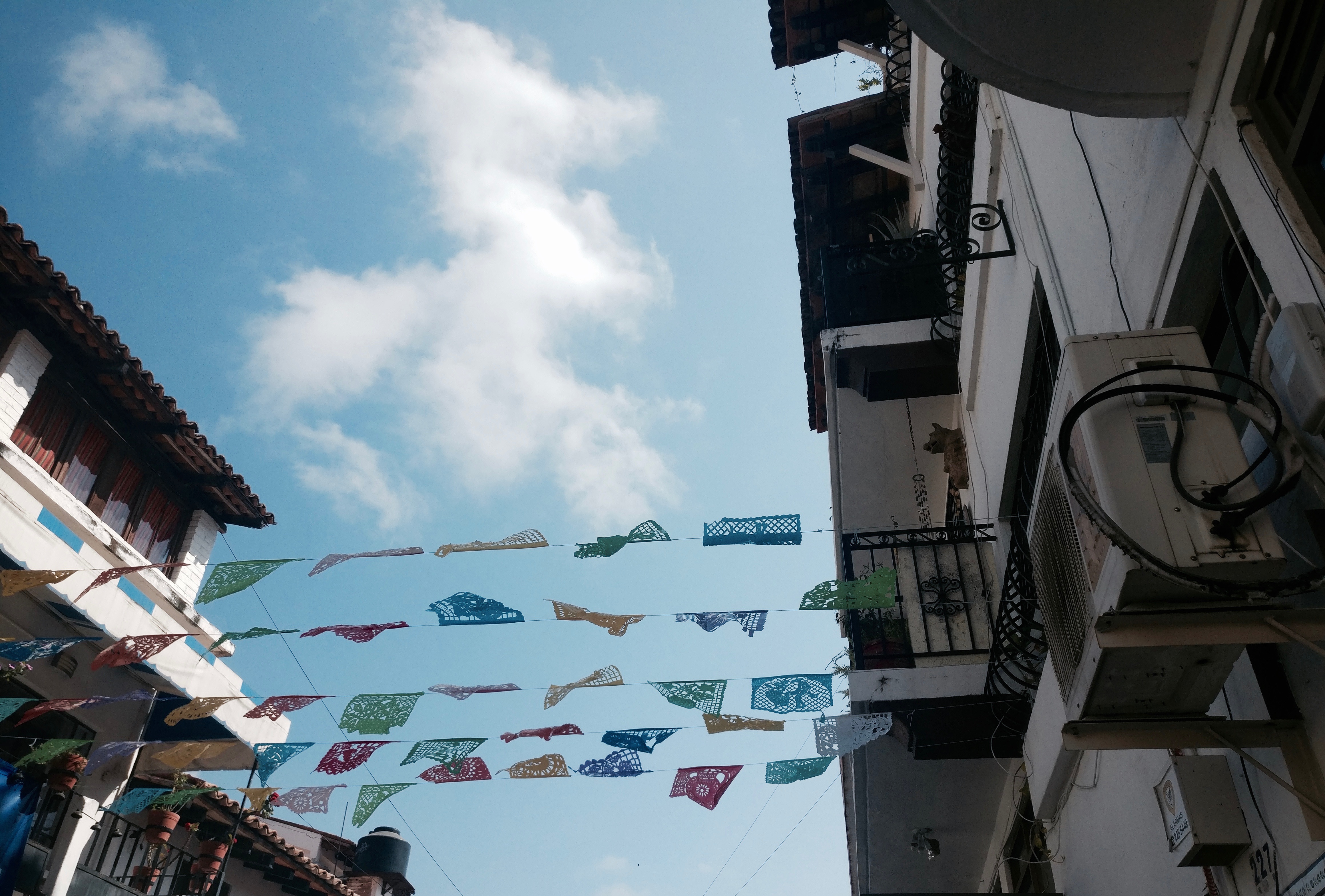 Papel Picado hangs over the street in Puerto Vallarta
