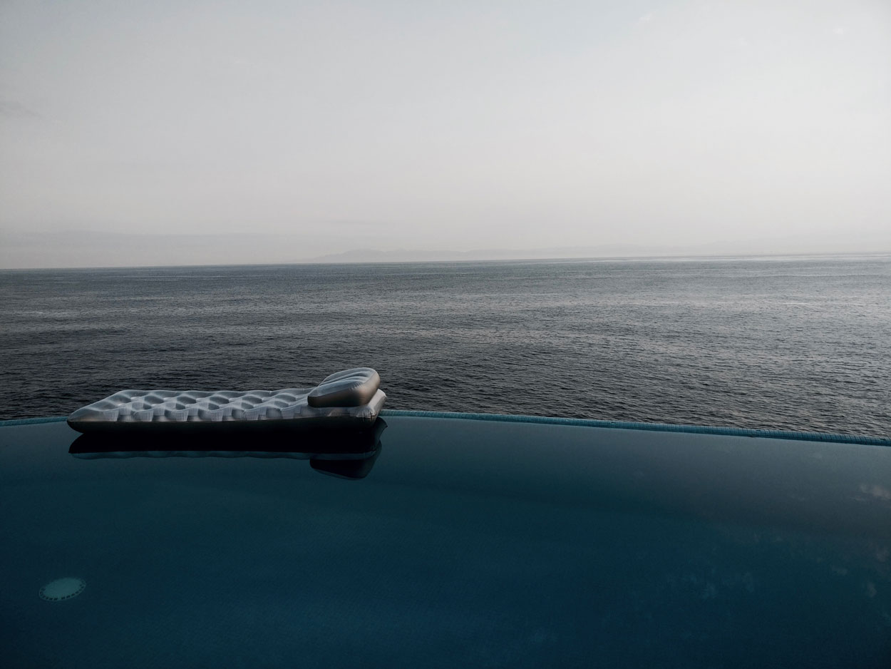 The infinity pool at Villa Mandarinas with a lounge float