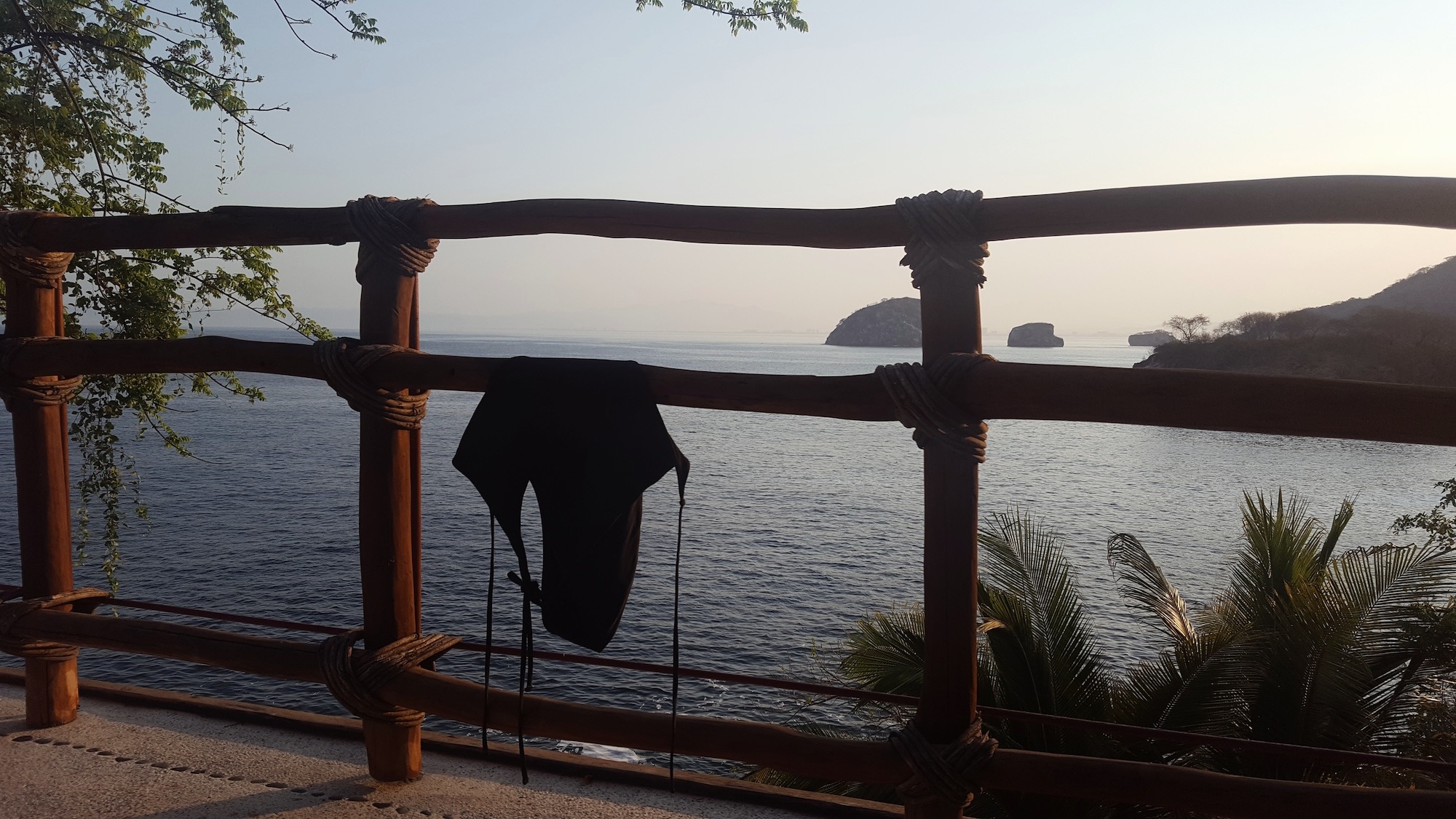 A swimsuit hangs on the balcony at Villa Mandarinas