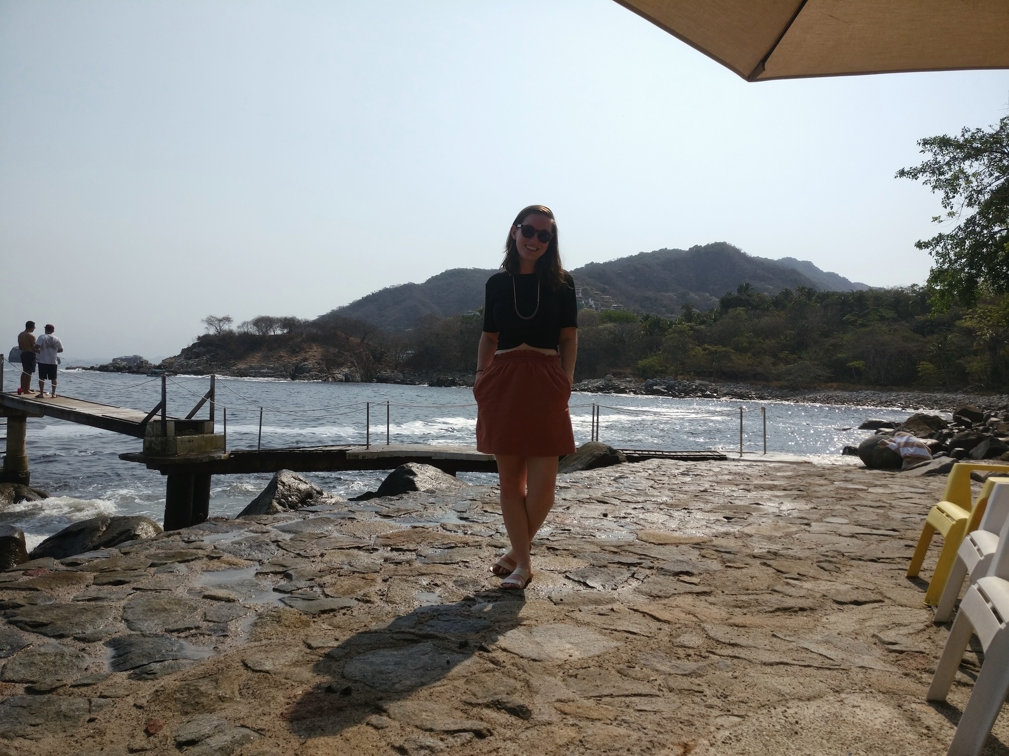 Alyssa stands by the water at Villa Mandarinas