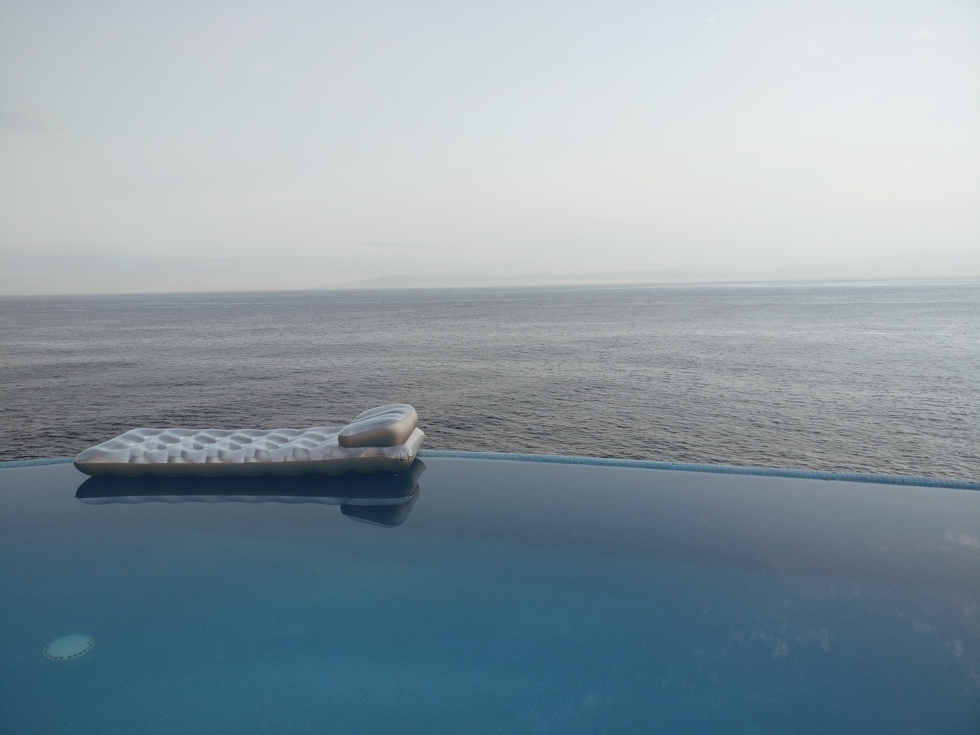The infinity pool at Villa Mandarinas with a lounge float