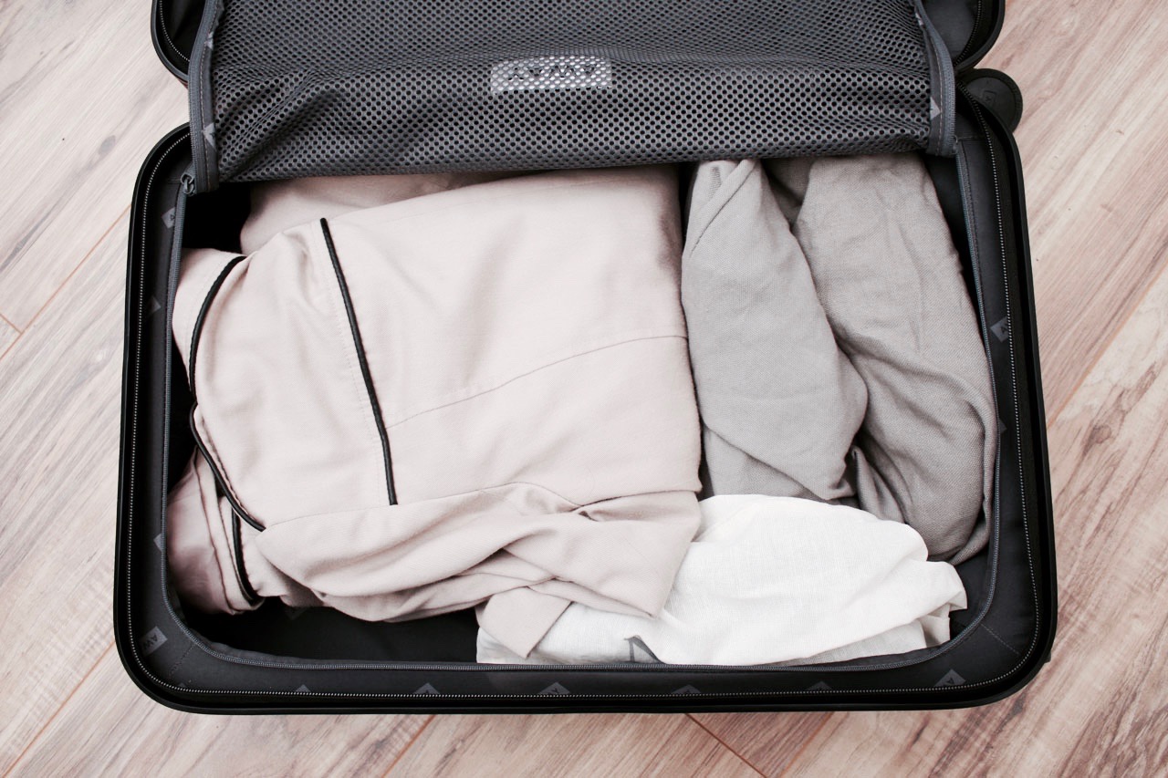 The zipper side of the Carry-On is packed with a trench coat and shoes