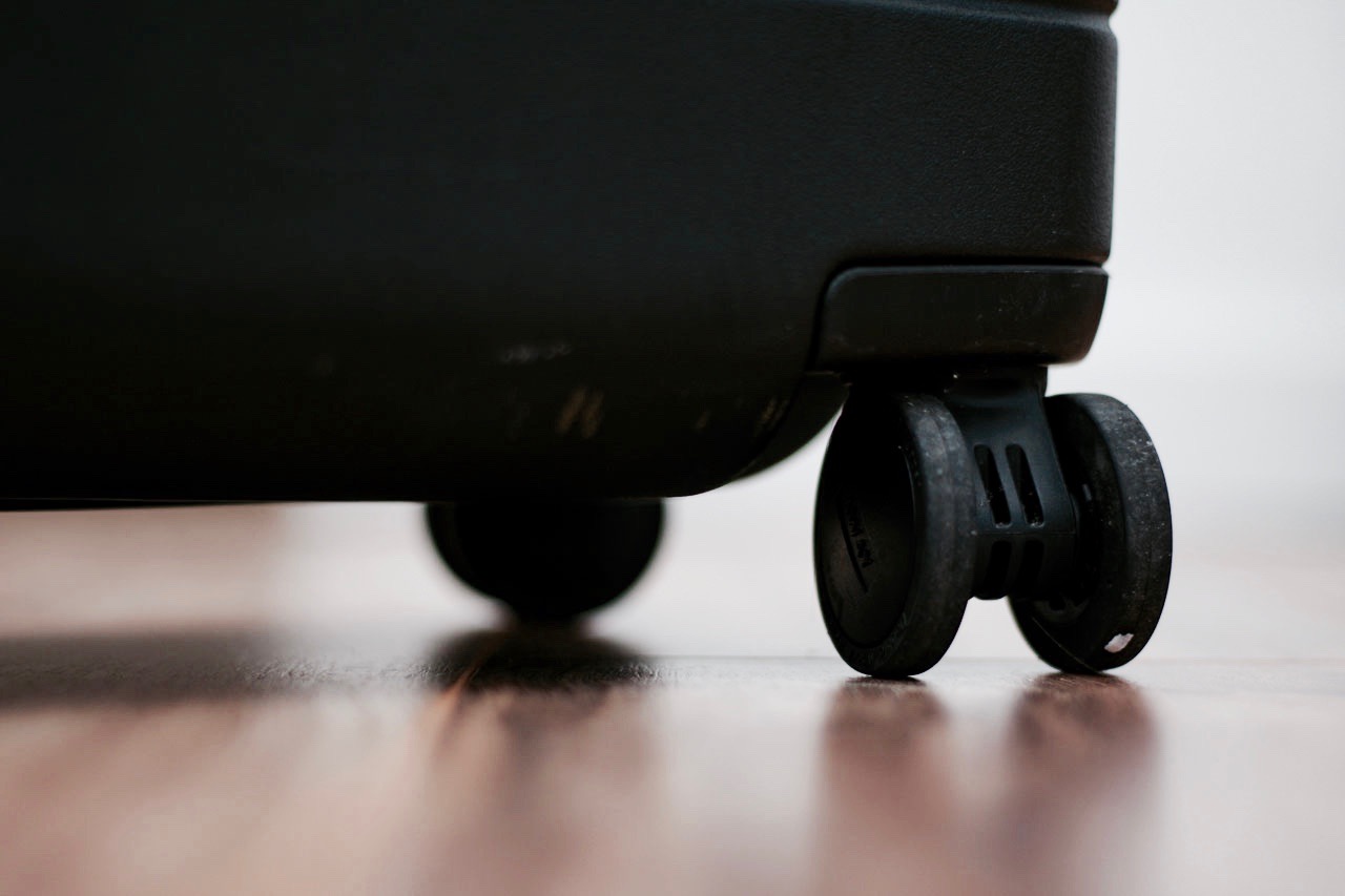 A close-up of the scuff marks on the wheels of the Away Carry-On