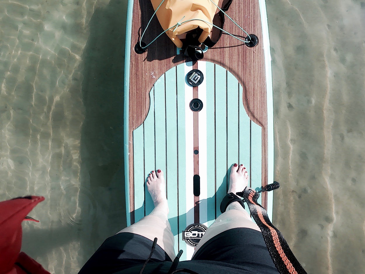 Alyssa stands on a SUP board in the Gulf of Mexico