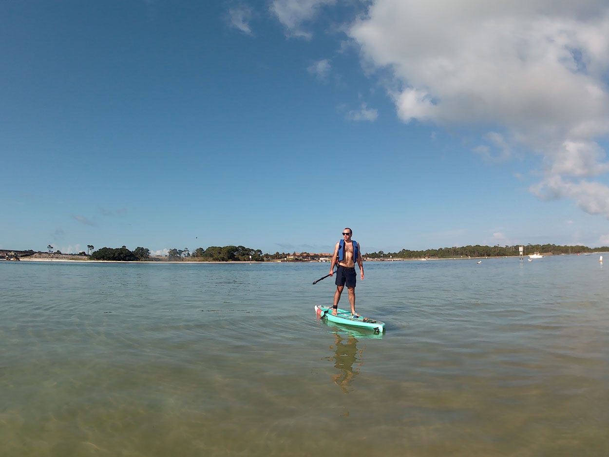 Michael stands on a paddleboard in the Gulf of Mexico