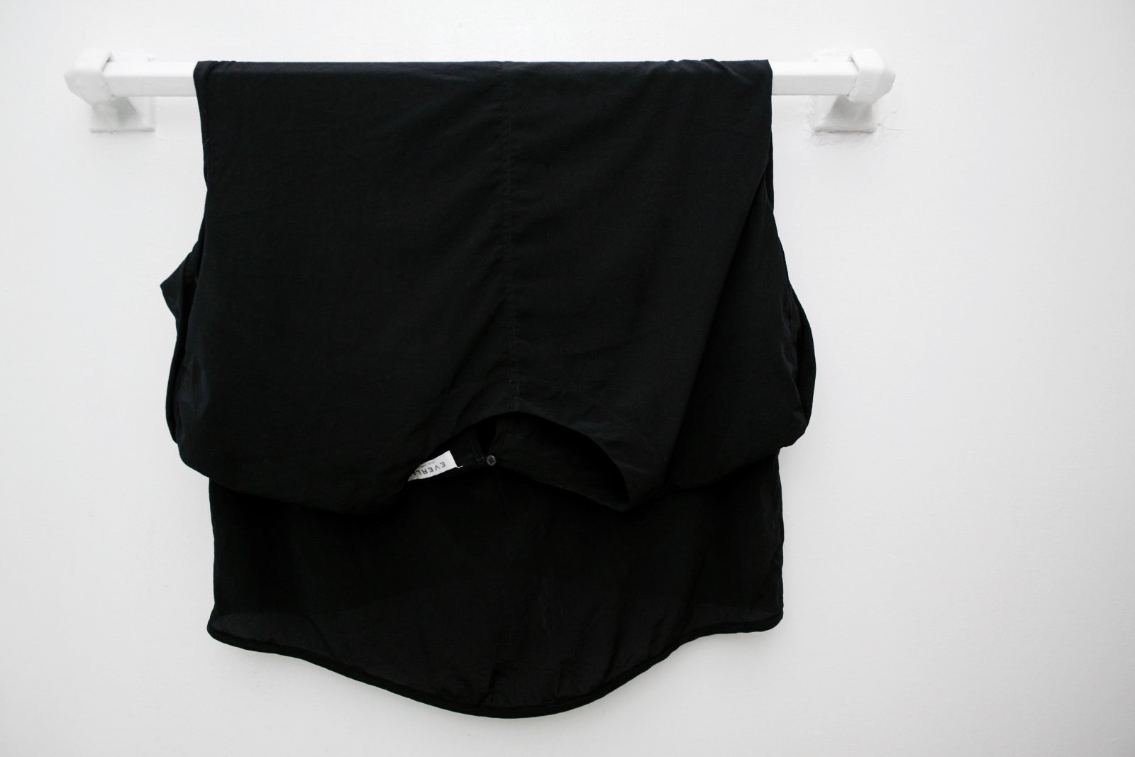 Dress hanging to dry on a towel rack