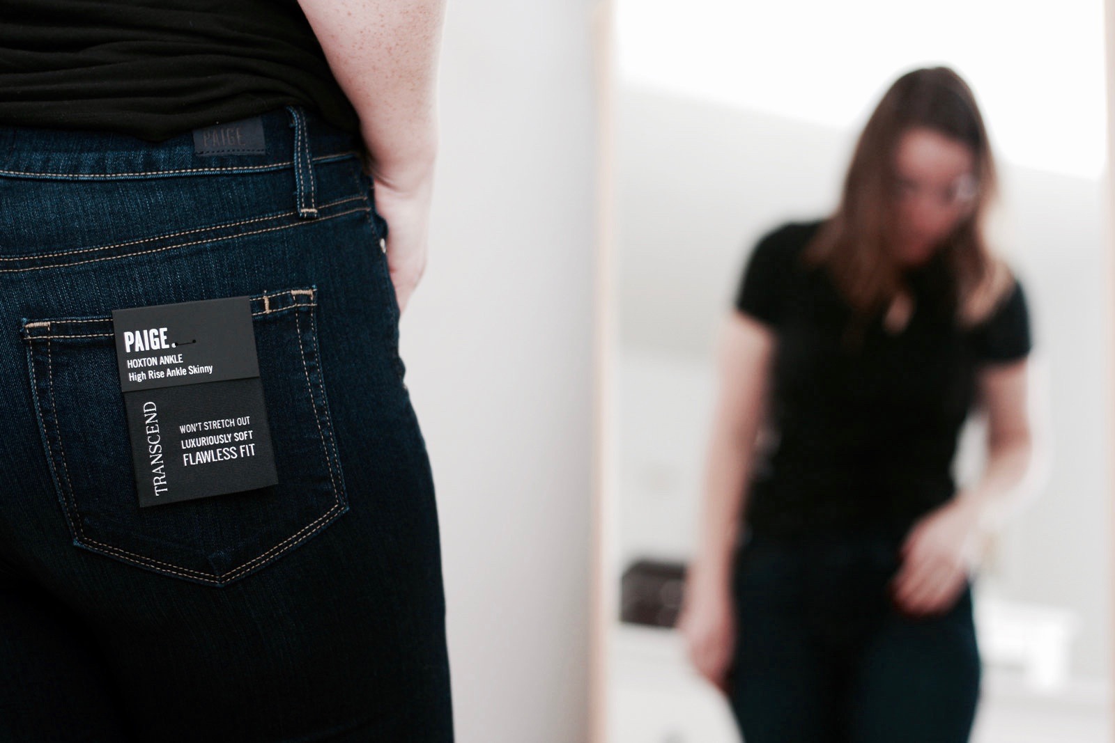 Alyssa wears a pair of Paige Hoxton Ankle Jeans