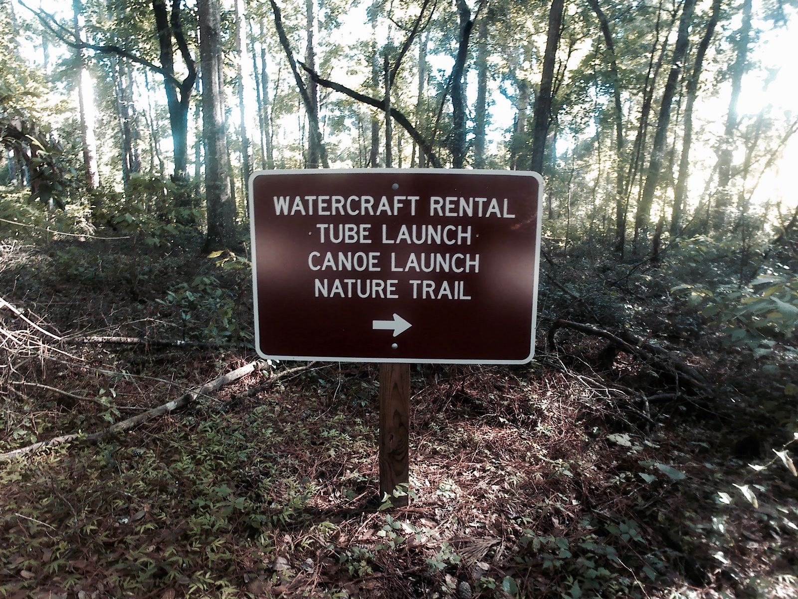 A sign indicating where to go for Ichetucknee Rentals