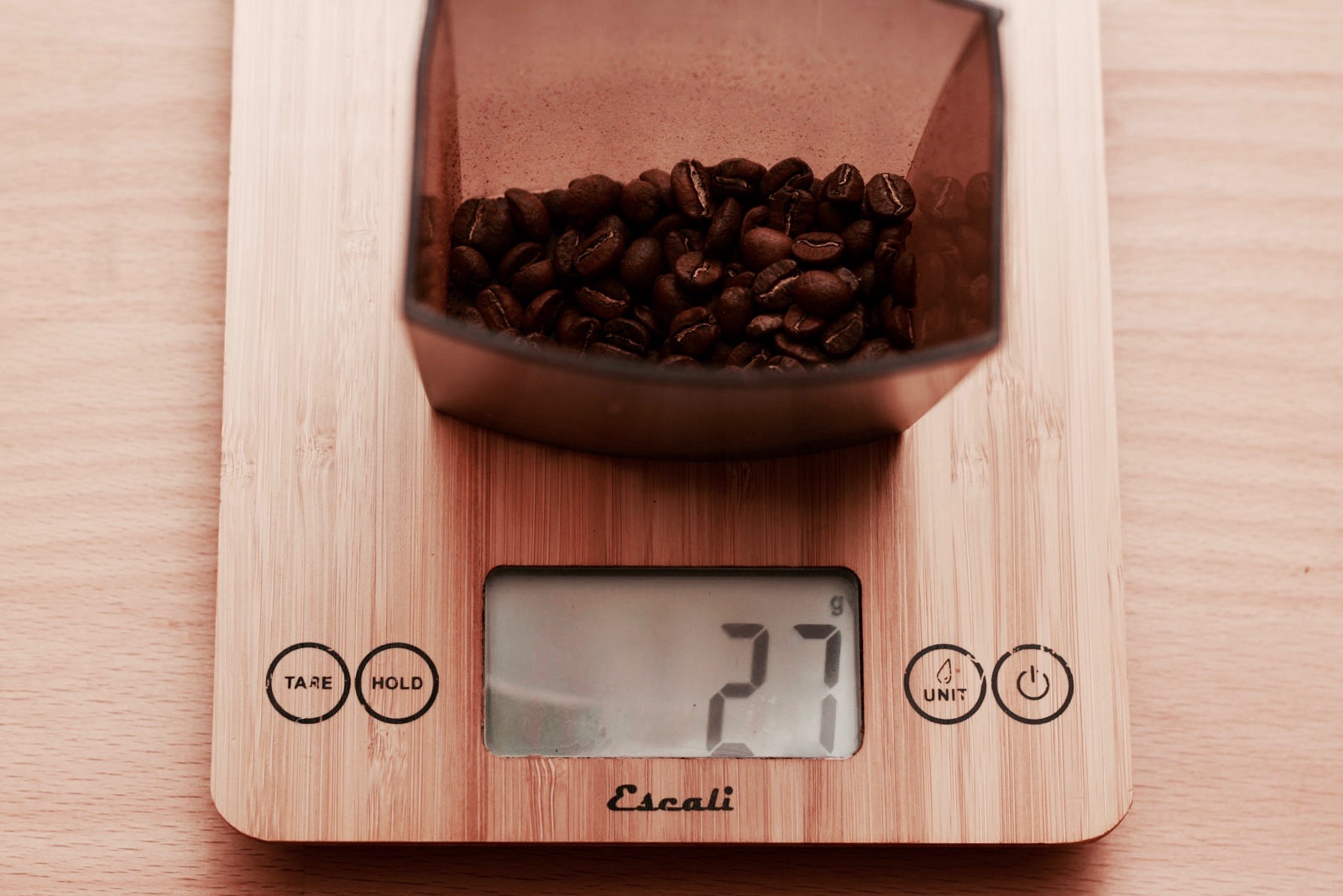 weighing the whole bean coffee to 27g