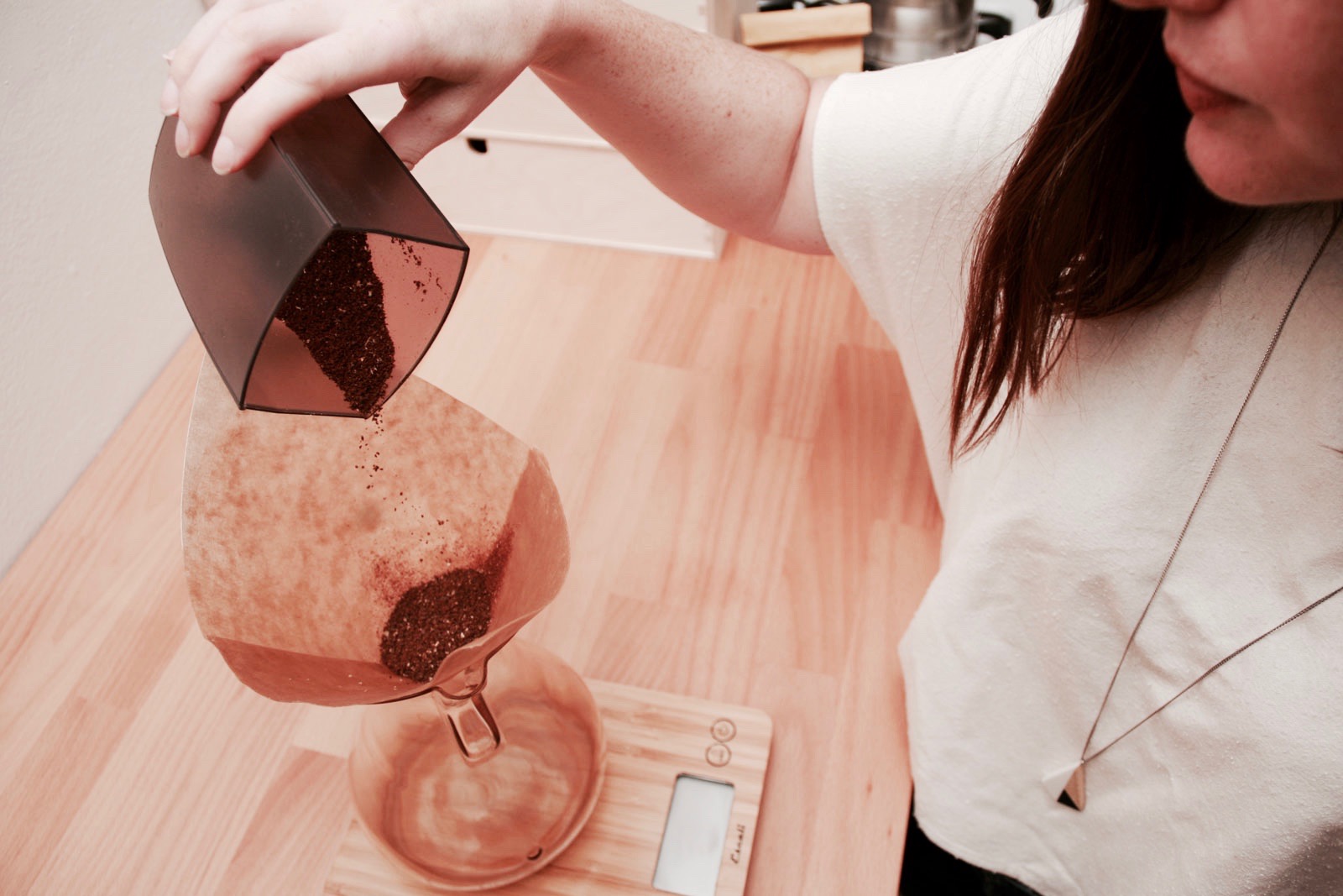 Pouring grounds into Chemex