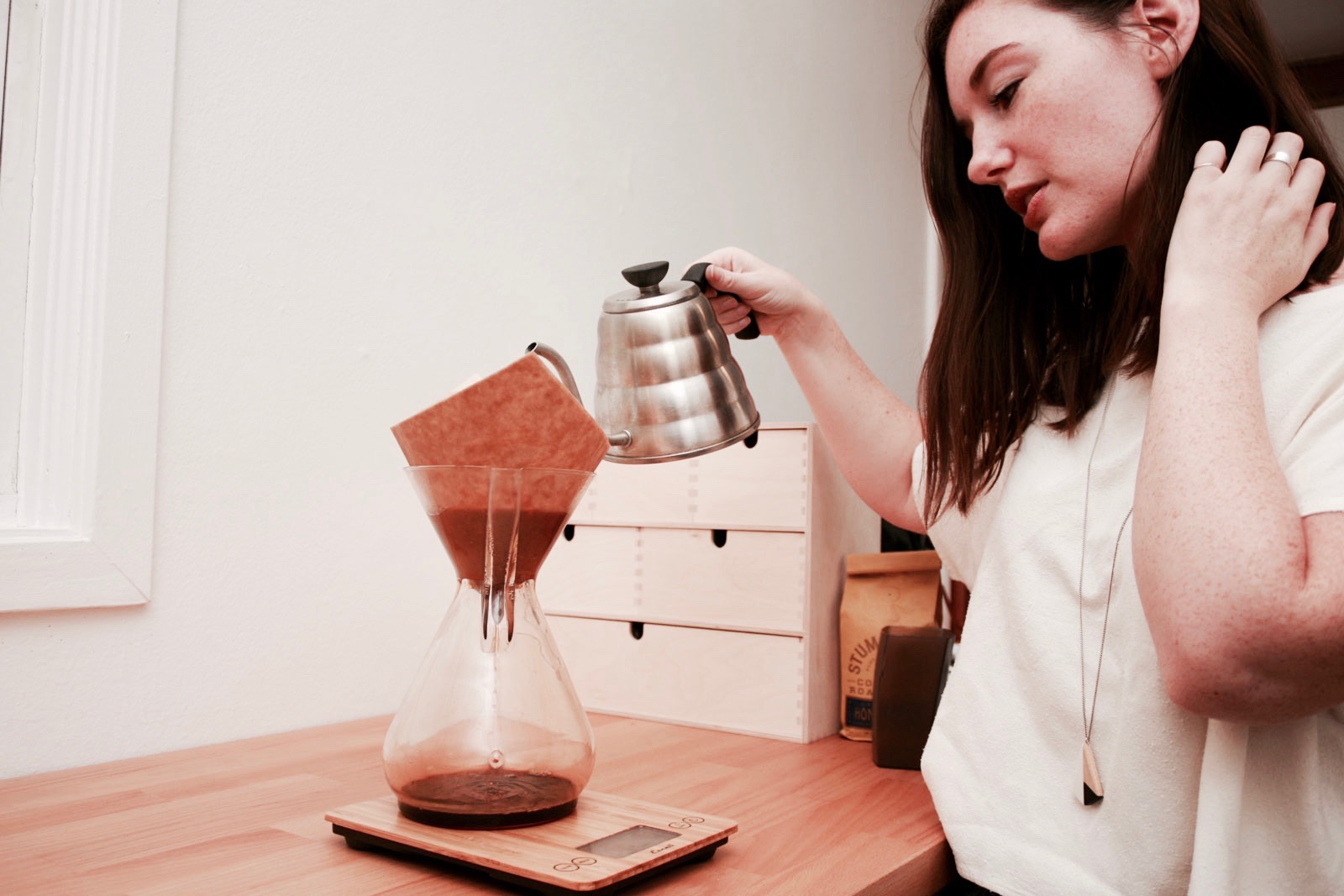 Alyssa pouring water to brew in the Chemex