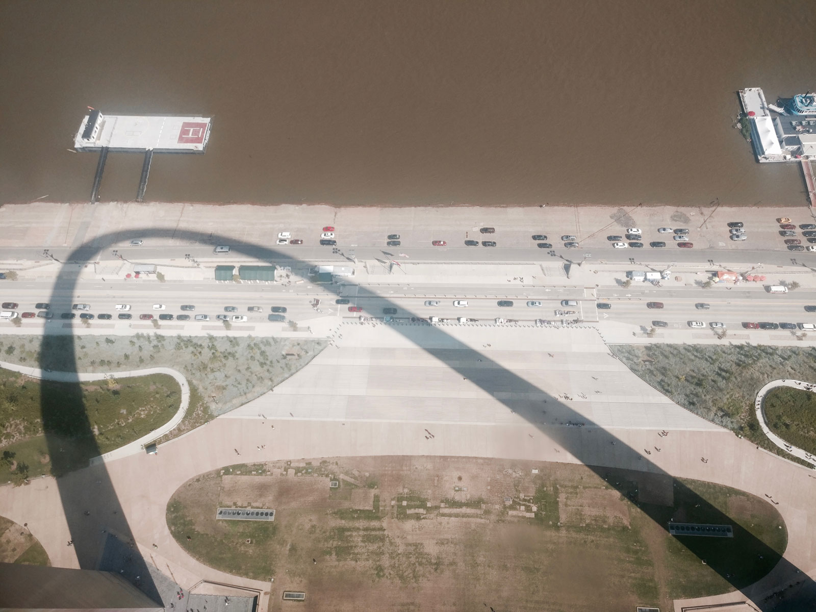 The Gateway Arch casts a shadow over the Mississippi River