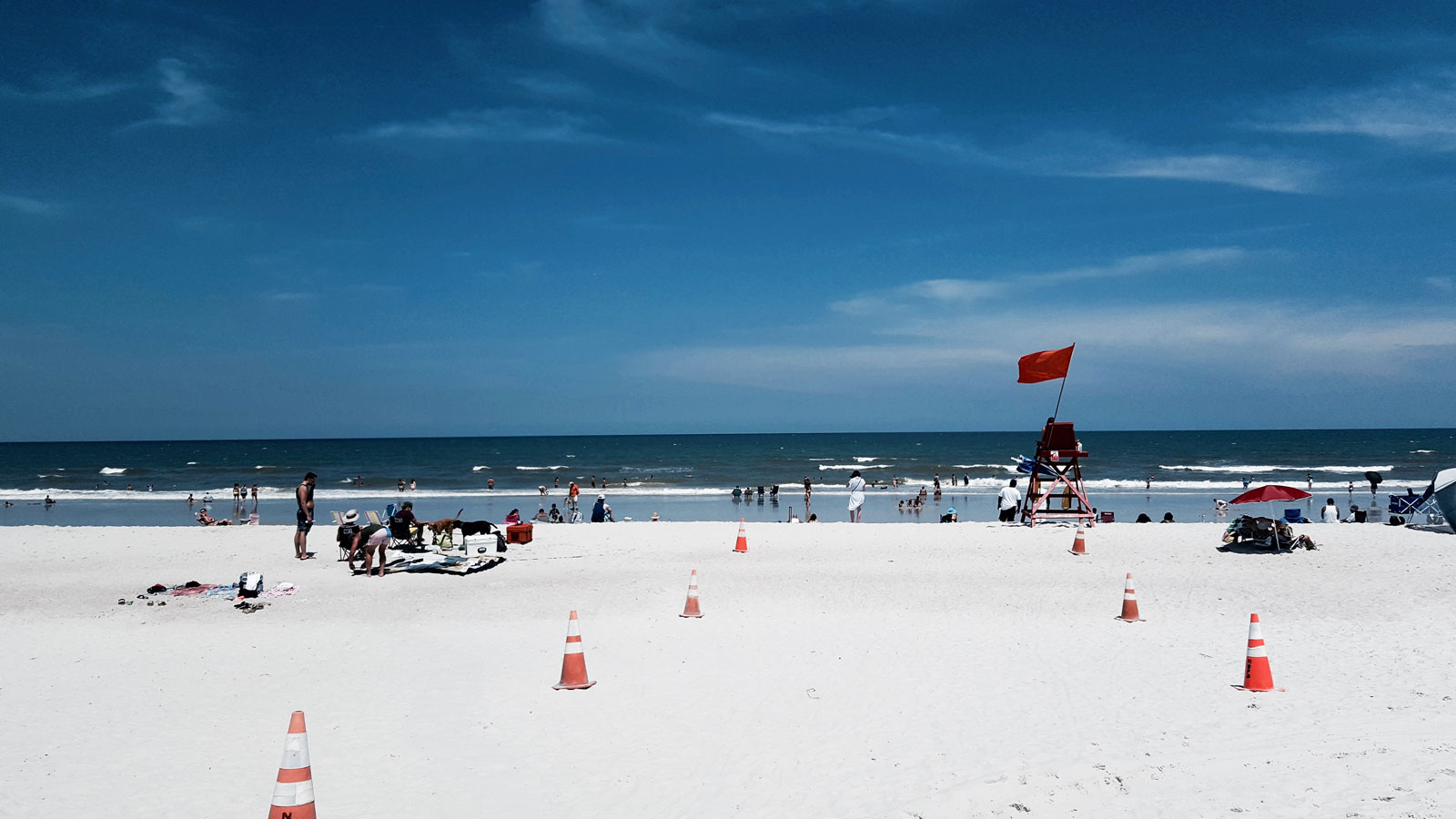 Beachgoers at Neptune Beach in Jacksonville FL