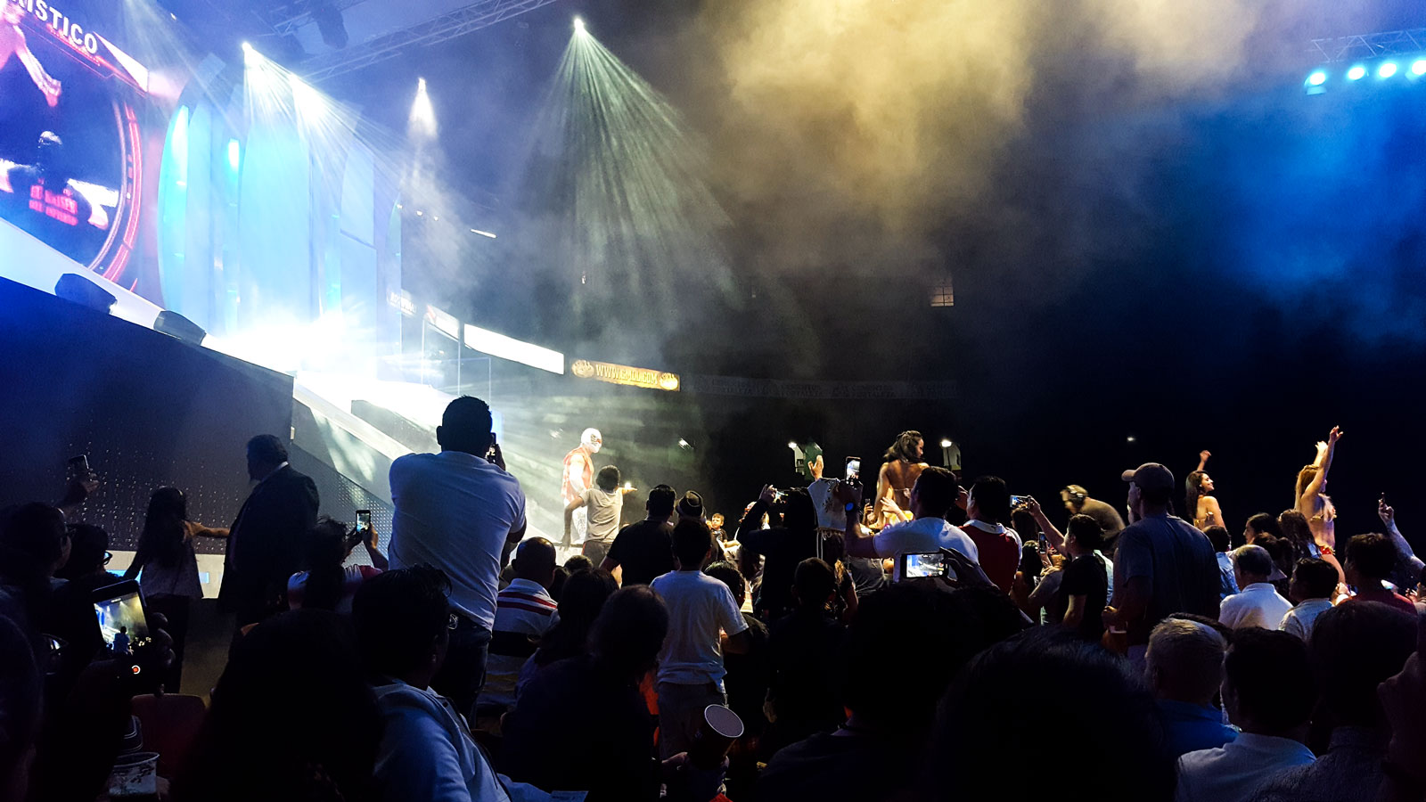 Luchadores enter the ring at a Lucha Libre match in Mexico City