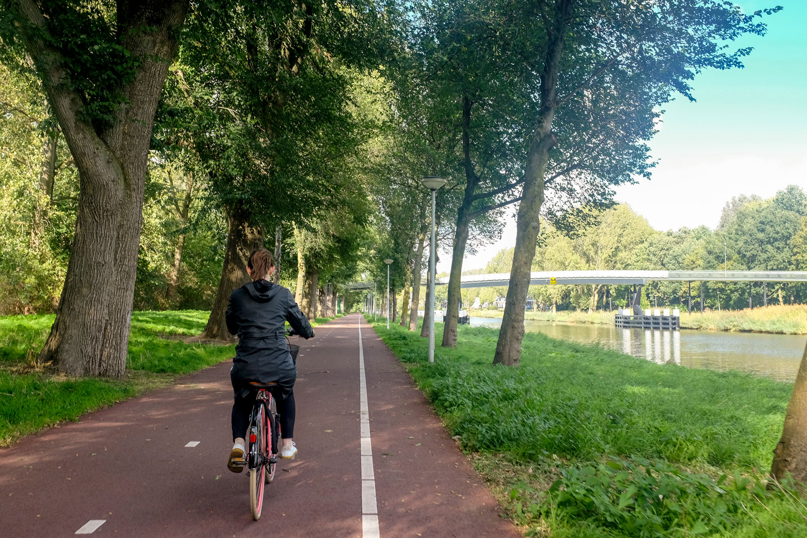 Alyssa bikes along the canals in Amsterdam