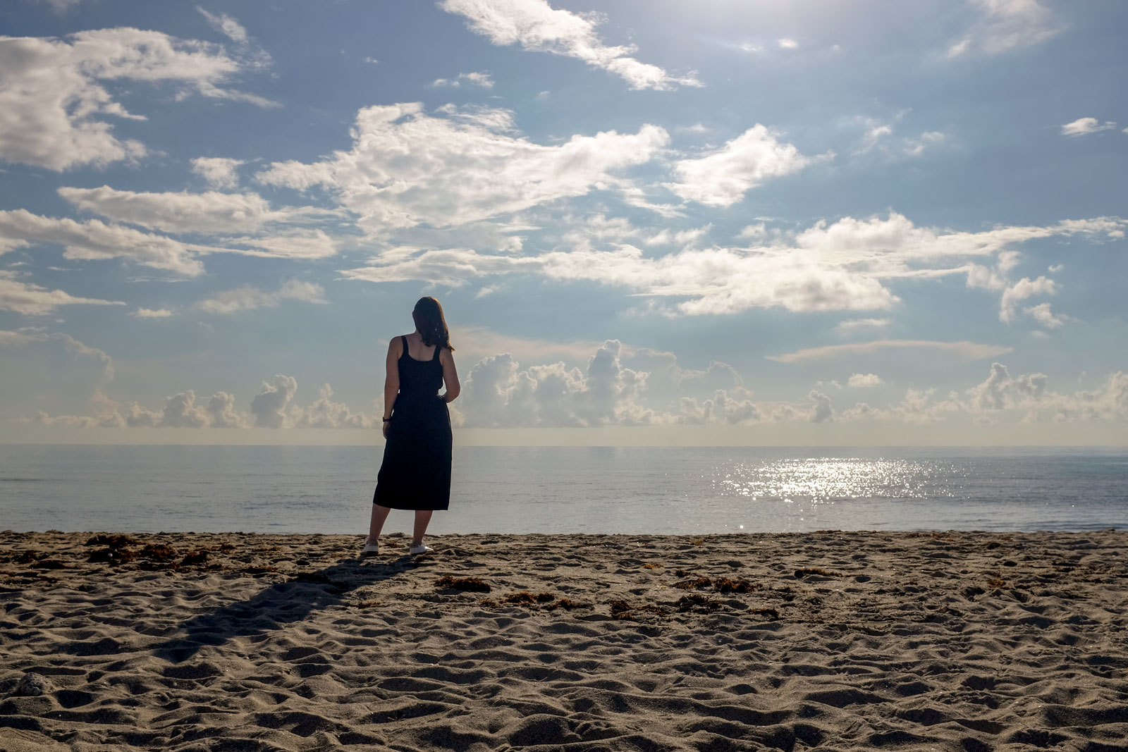 Alyssa stands in silhouette on Miami Beach