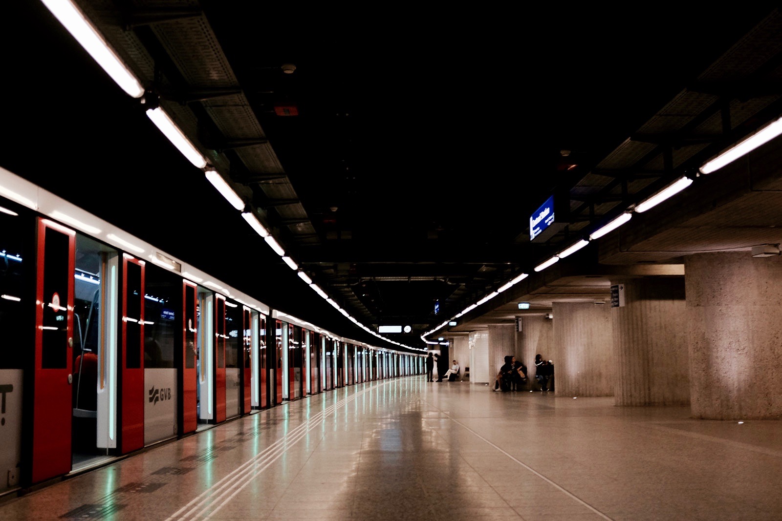 An Amsterdam Metro station with a train on the tracks