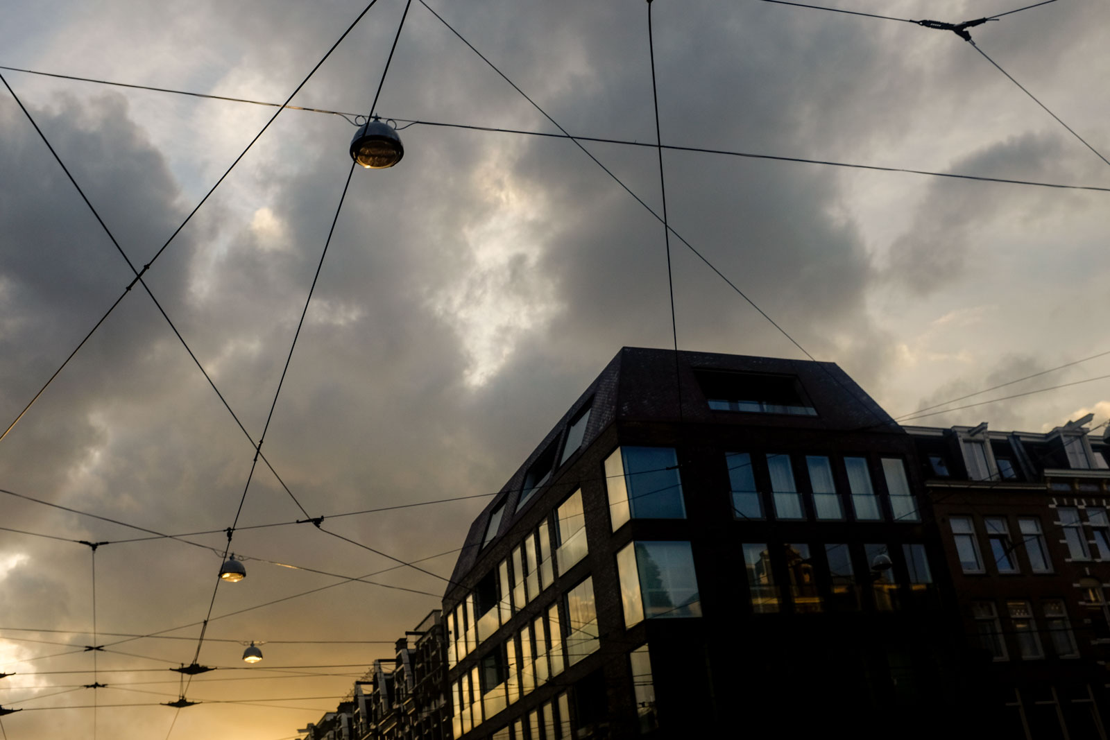 Tram lines in the sky at sunset in Amsterdam
