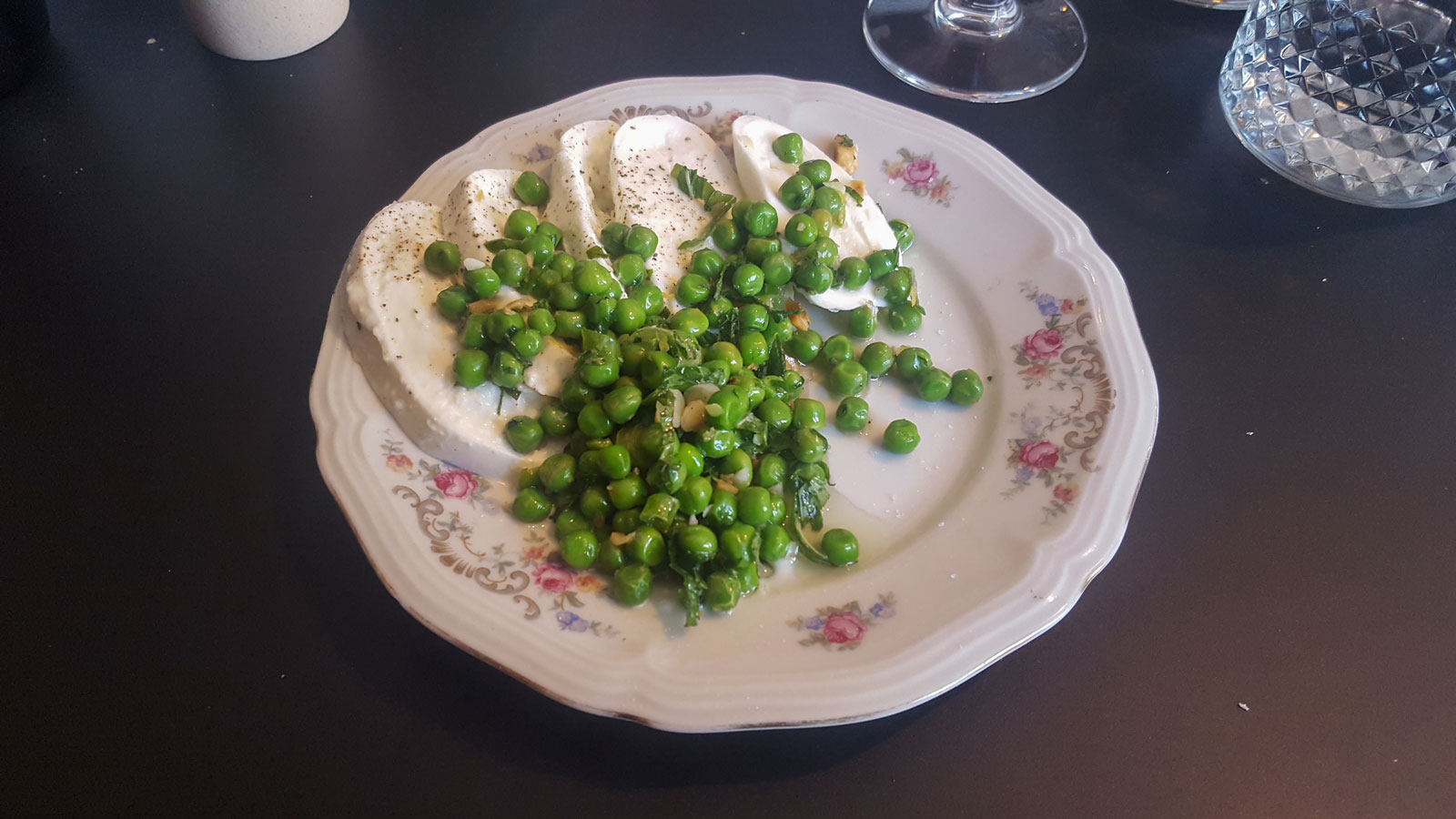 A plate with cheese and peas at Alix