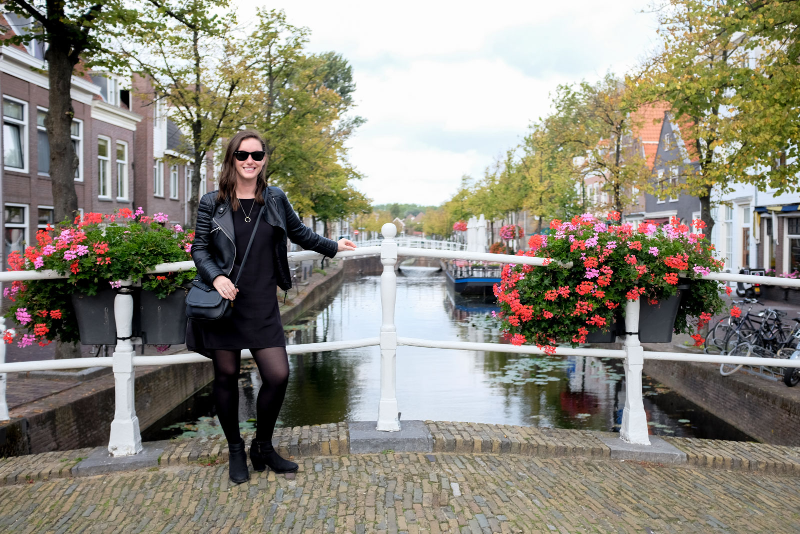 Alyssa stands in front of a canal in Delft