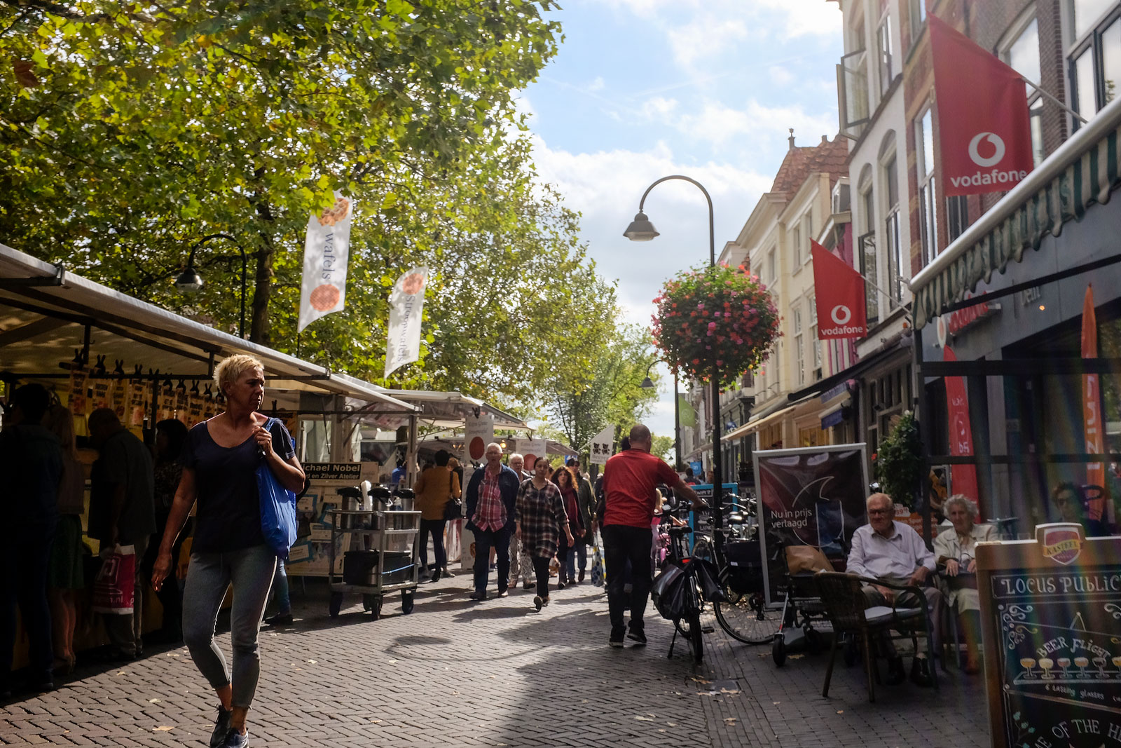 People walk through Delft Market
