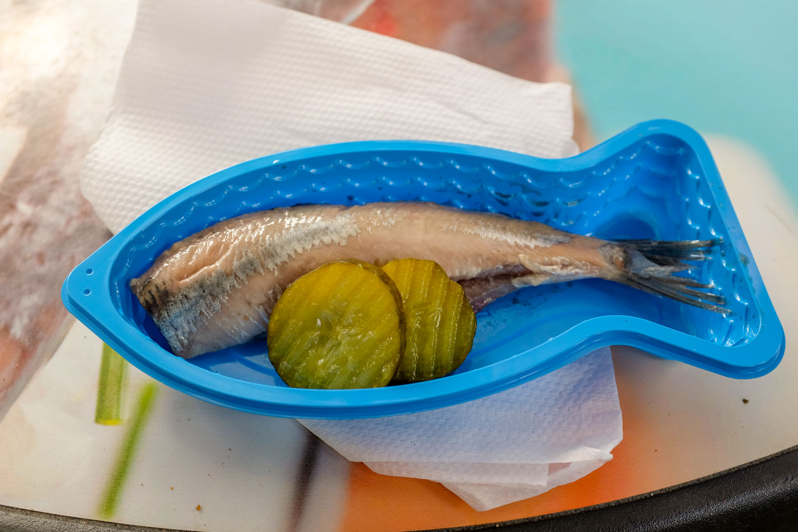 A tray of herring at Delft Market with pickles