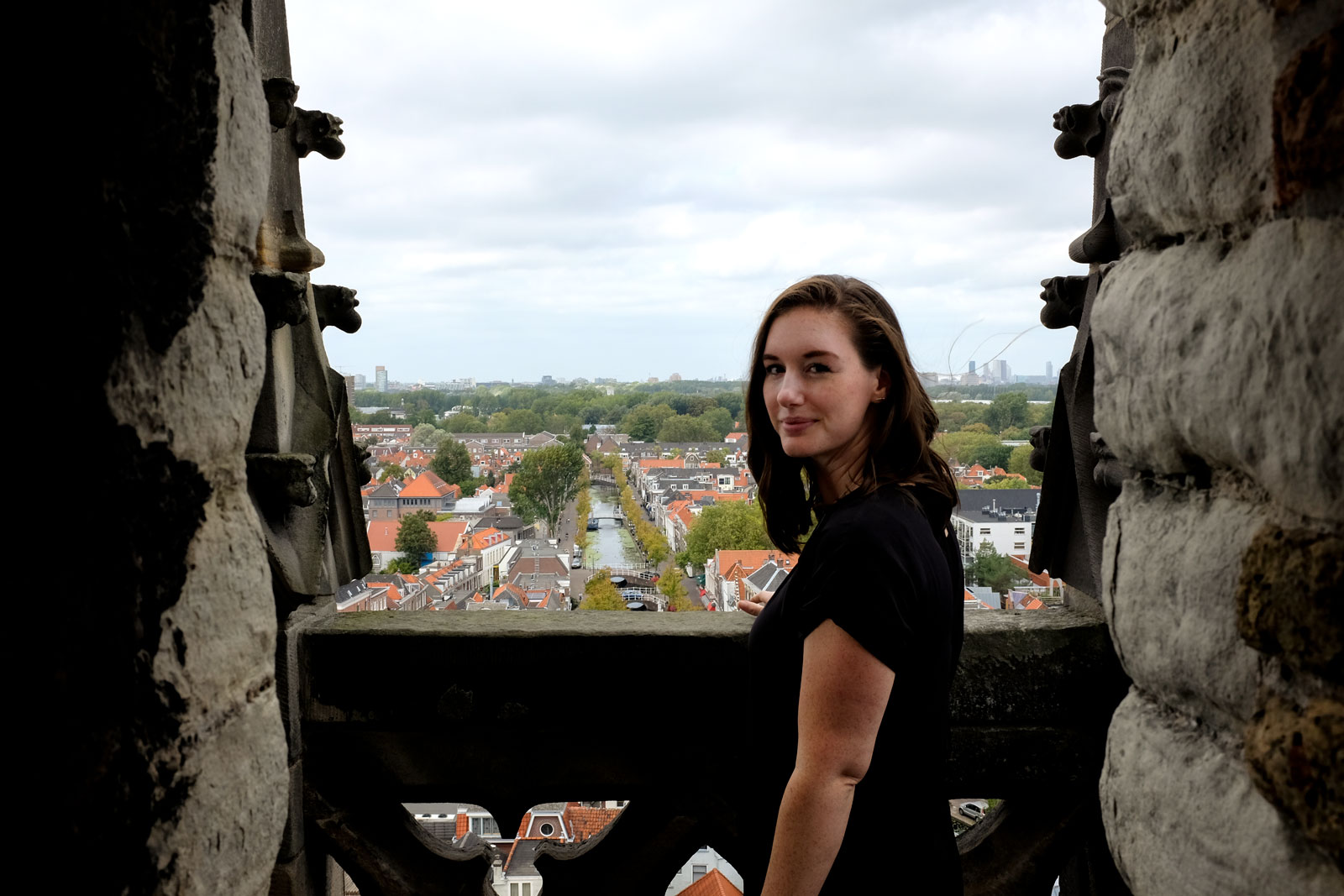 Alyssa stands at the top of the tower of Delft's New Church