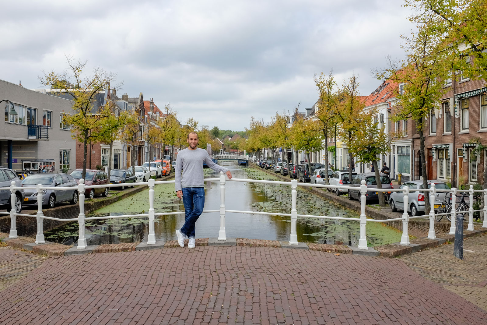 Michael poses for a photo at Delft's canal
