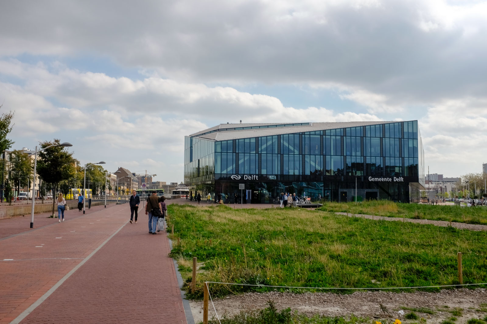 The Delft Train Station is seen in the distance