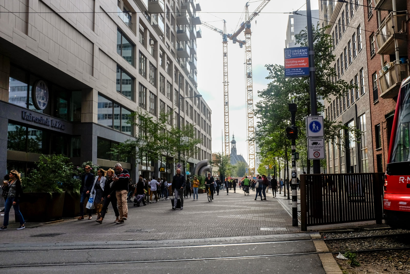 People walk down a pedestrian street in Den Haag