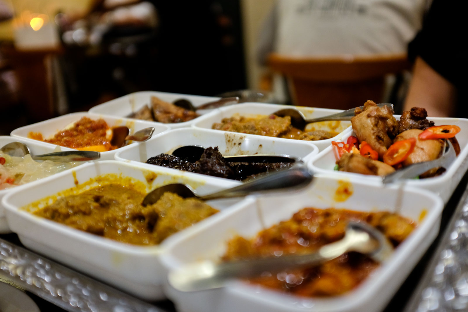 Trays of small dishes at Istana