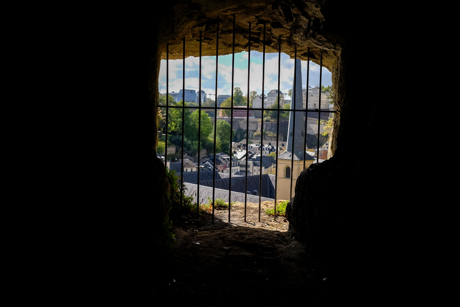 View of the city through the rocks at the Casemates du Bock in Luxembourg