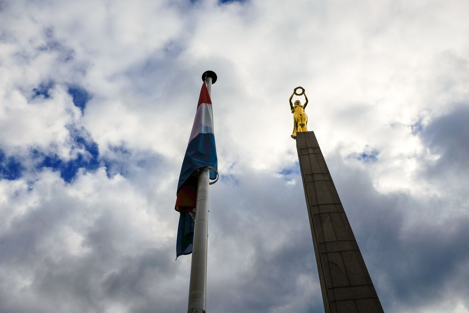 The Gëlle Fra monument and Luxembourg flag in the sky
