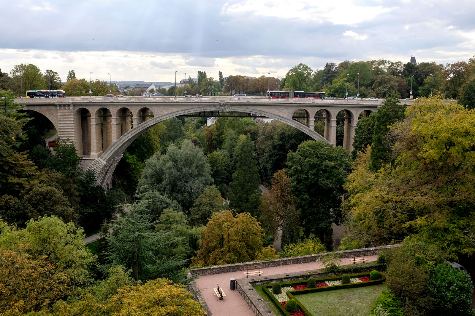 Cars drive along the Pont Adolphe in Luxembourg City