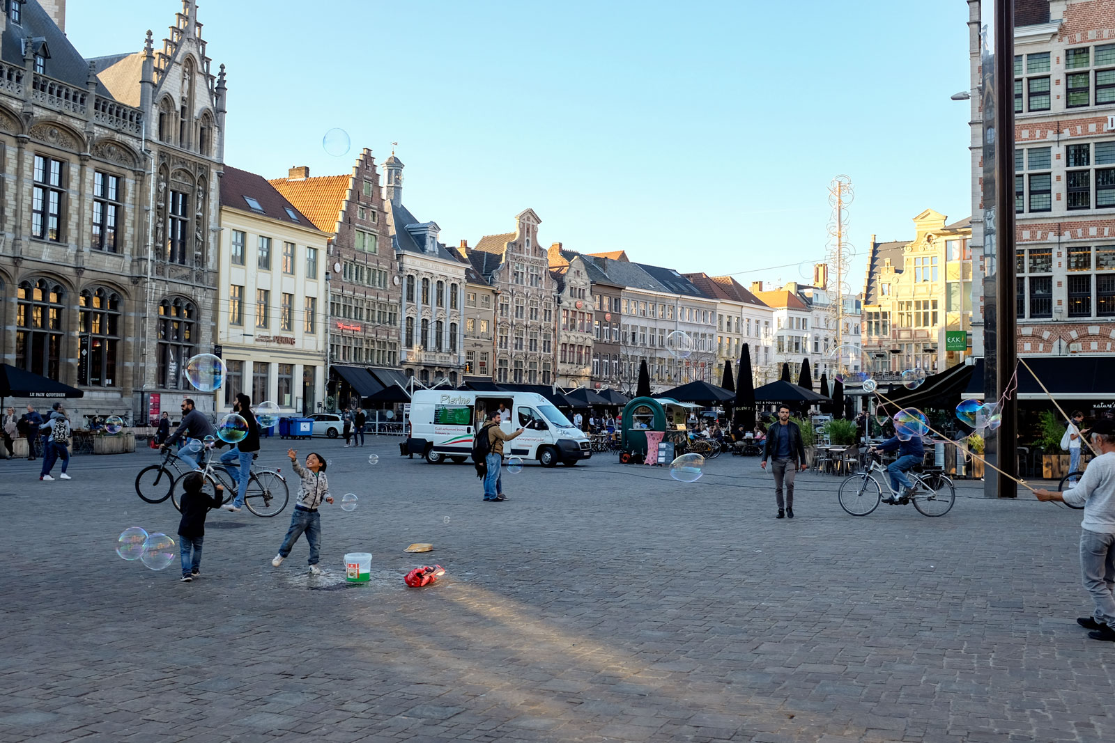 People play with bubbles in a Ghent Square