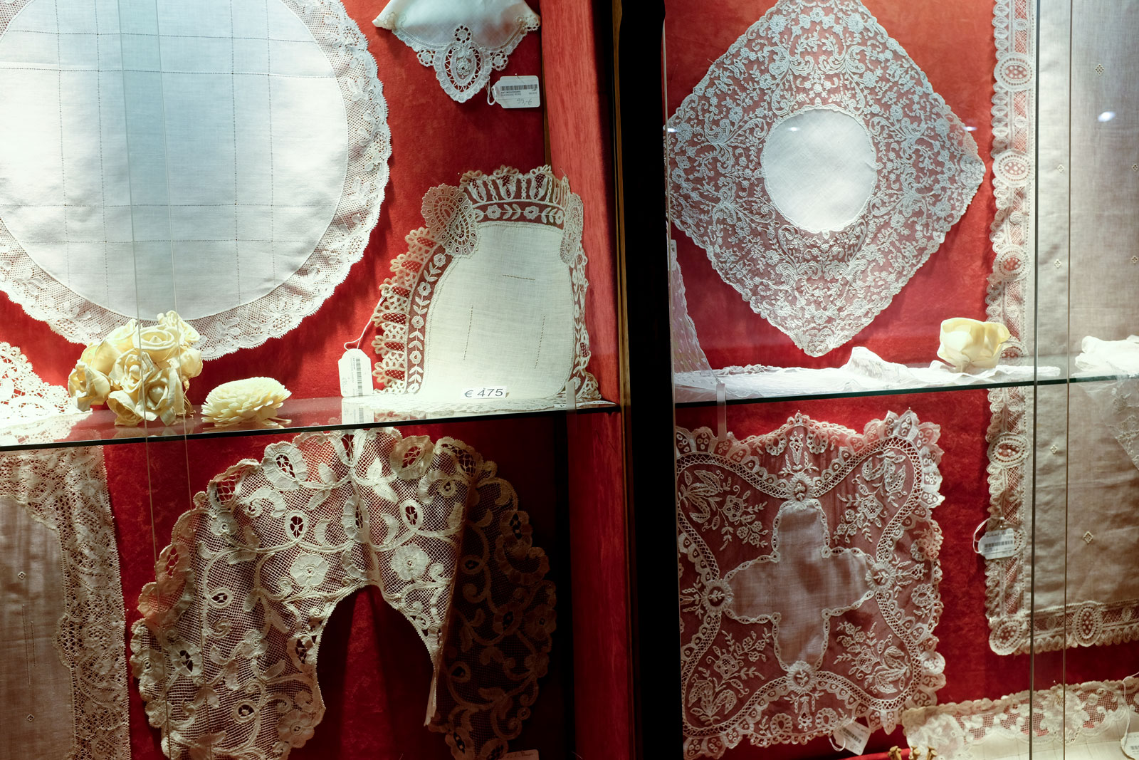 A display of lace in a window in Bruges