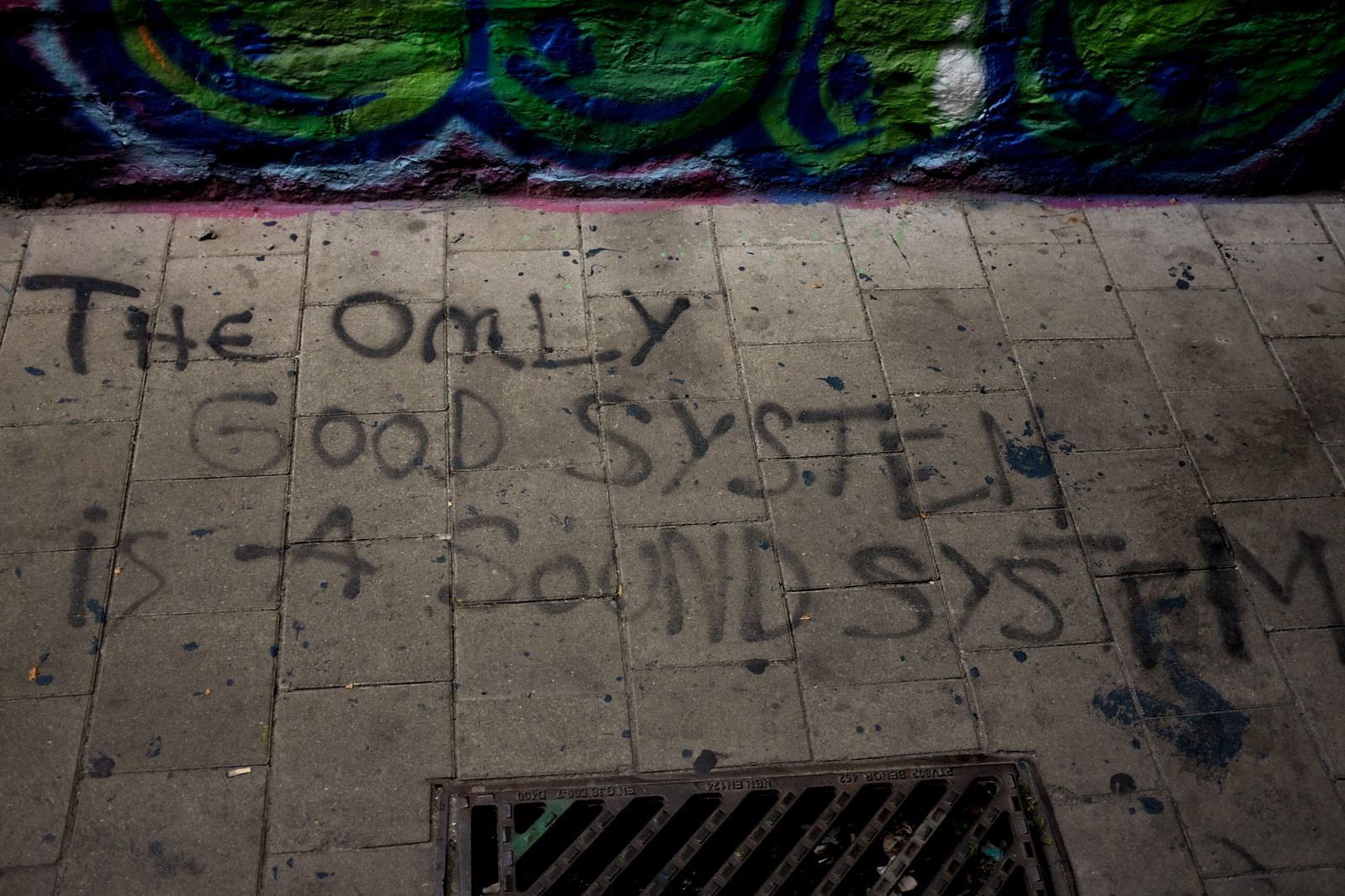 Graffiti on the Graffiti Street in Ghent that reads "The only good system is a sound system"