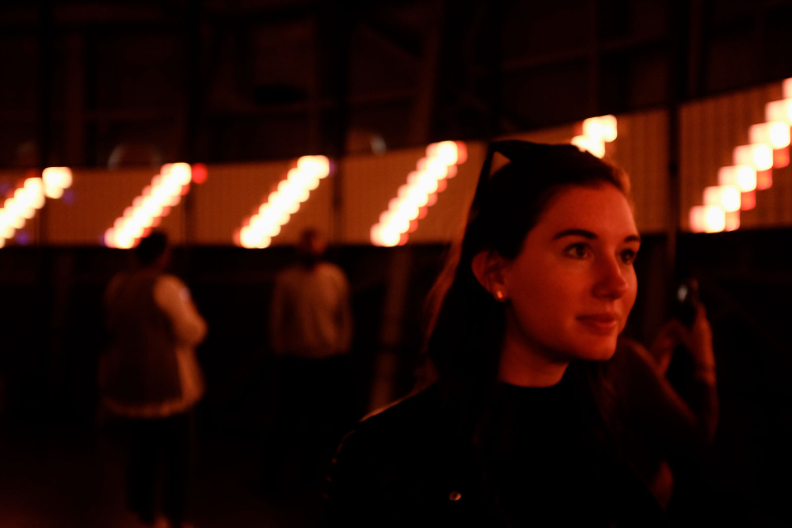 Alyssa glows red from a show at the Atomium