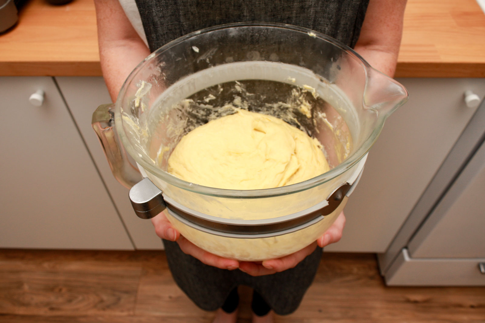 Alyssa holds a bowl of chilled dough