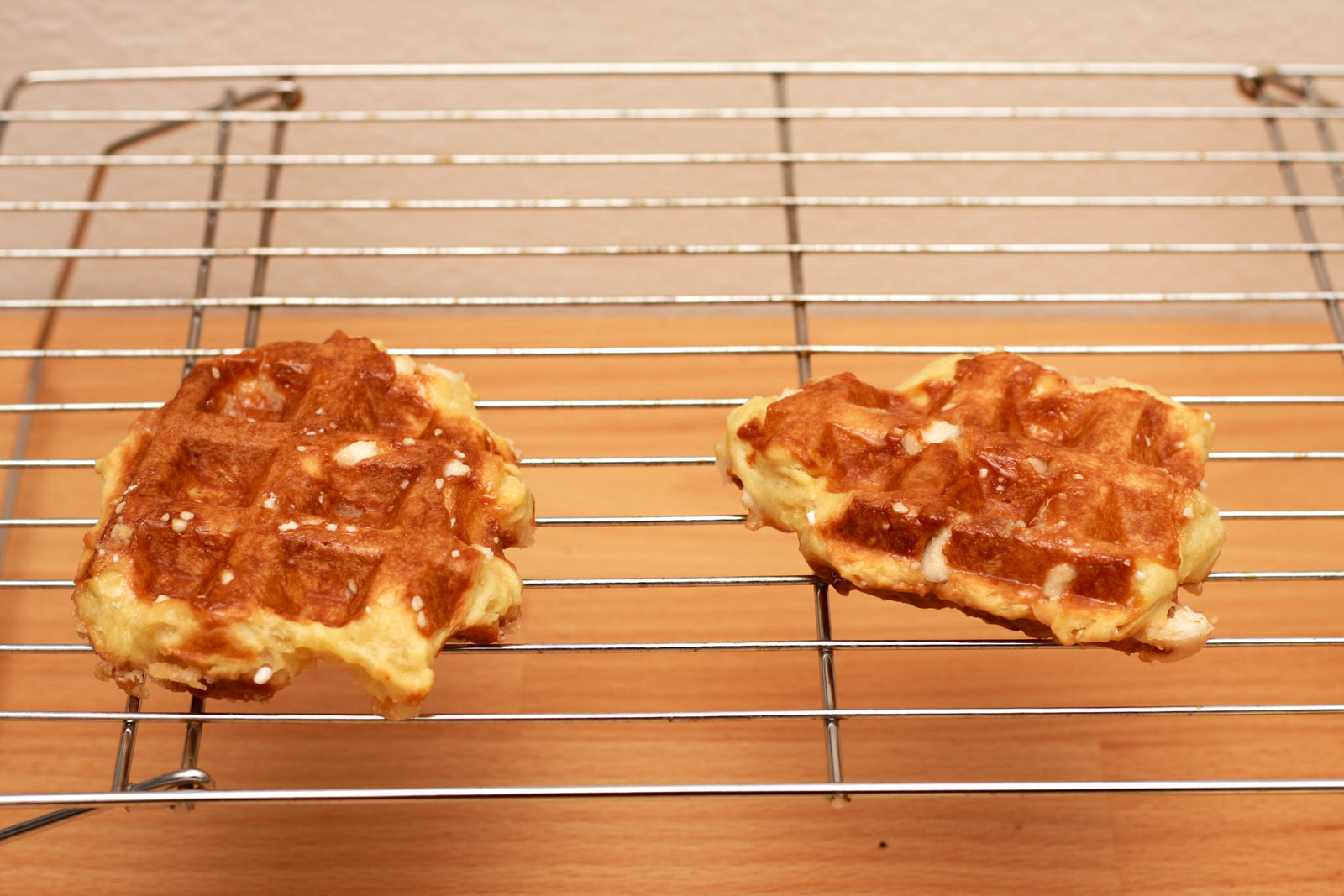 Two waffles on a cooling rack