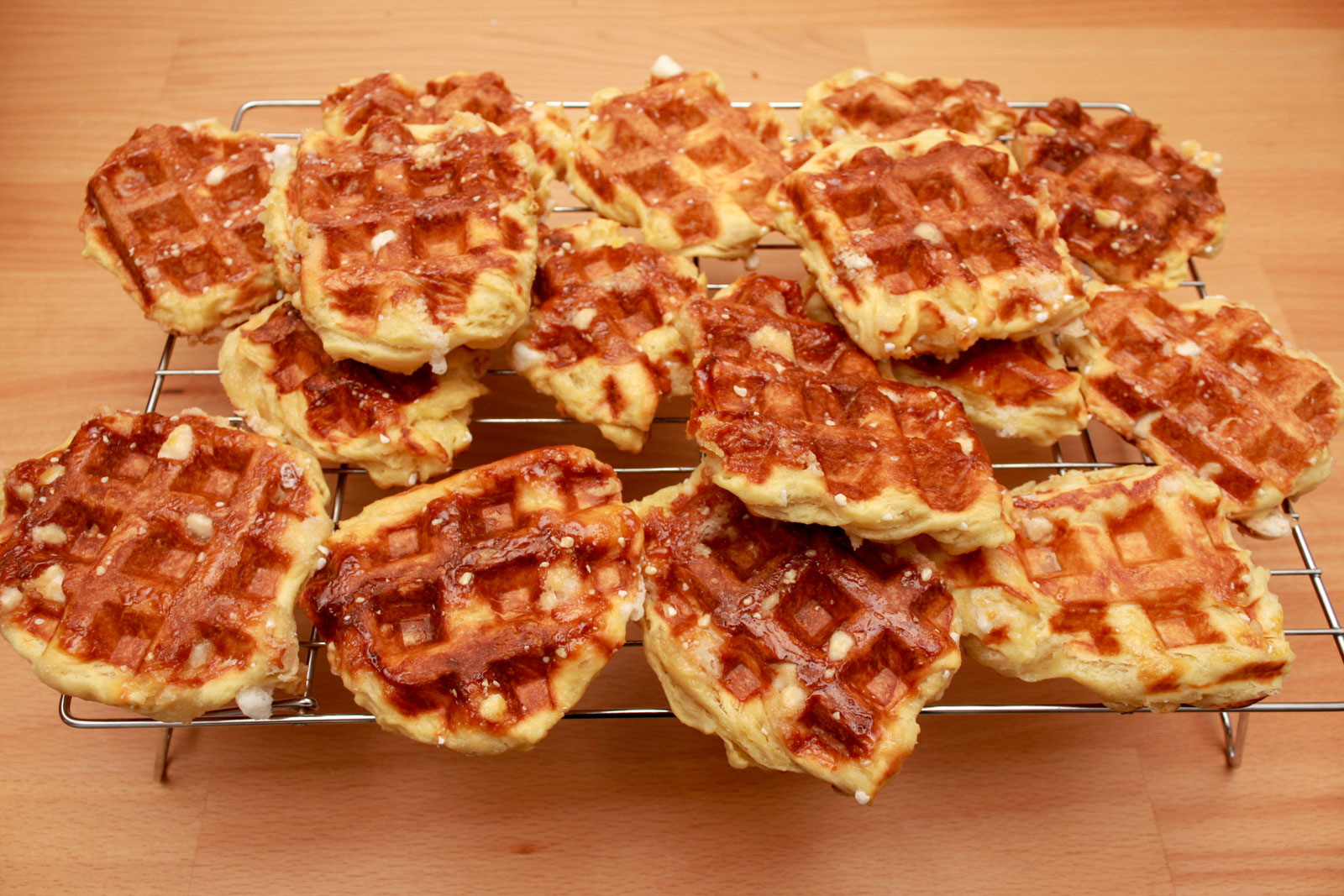 A cooling rack with lots of waffles