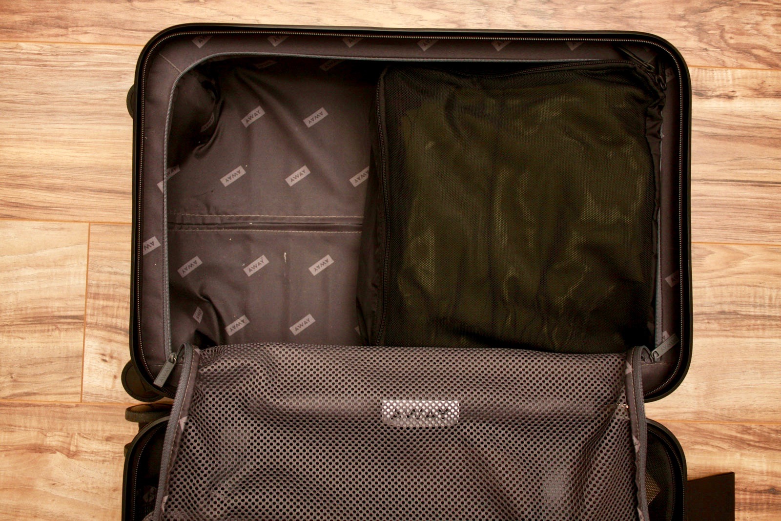 One Packing Cube inside an Away suitcase
