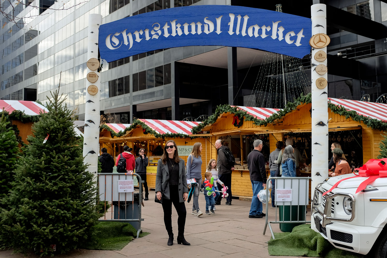 Alyssa stands under the Christkindl Market sign in Denver