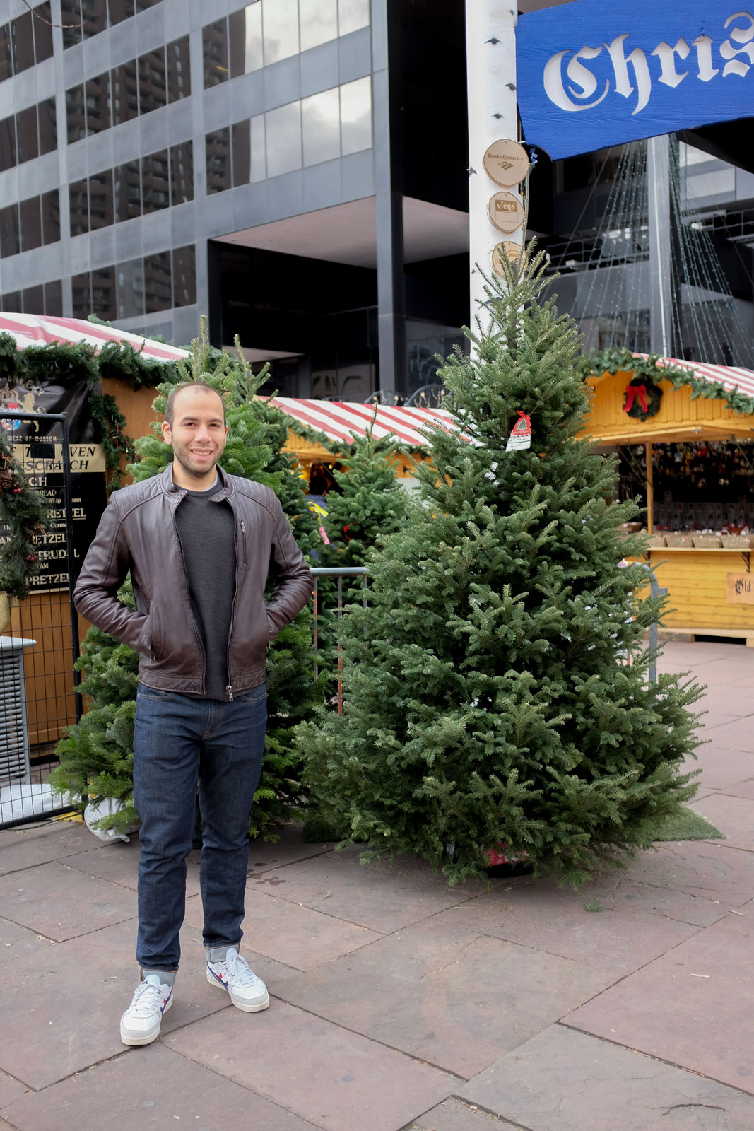 Michael stands by a tree at Christkindl Market Denver